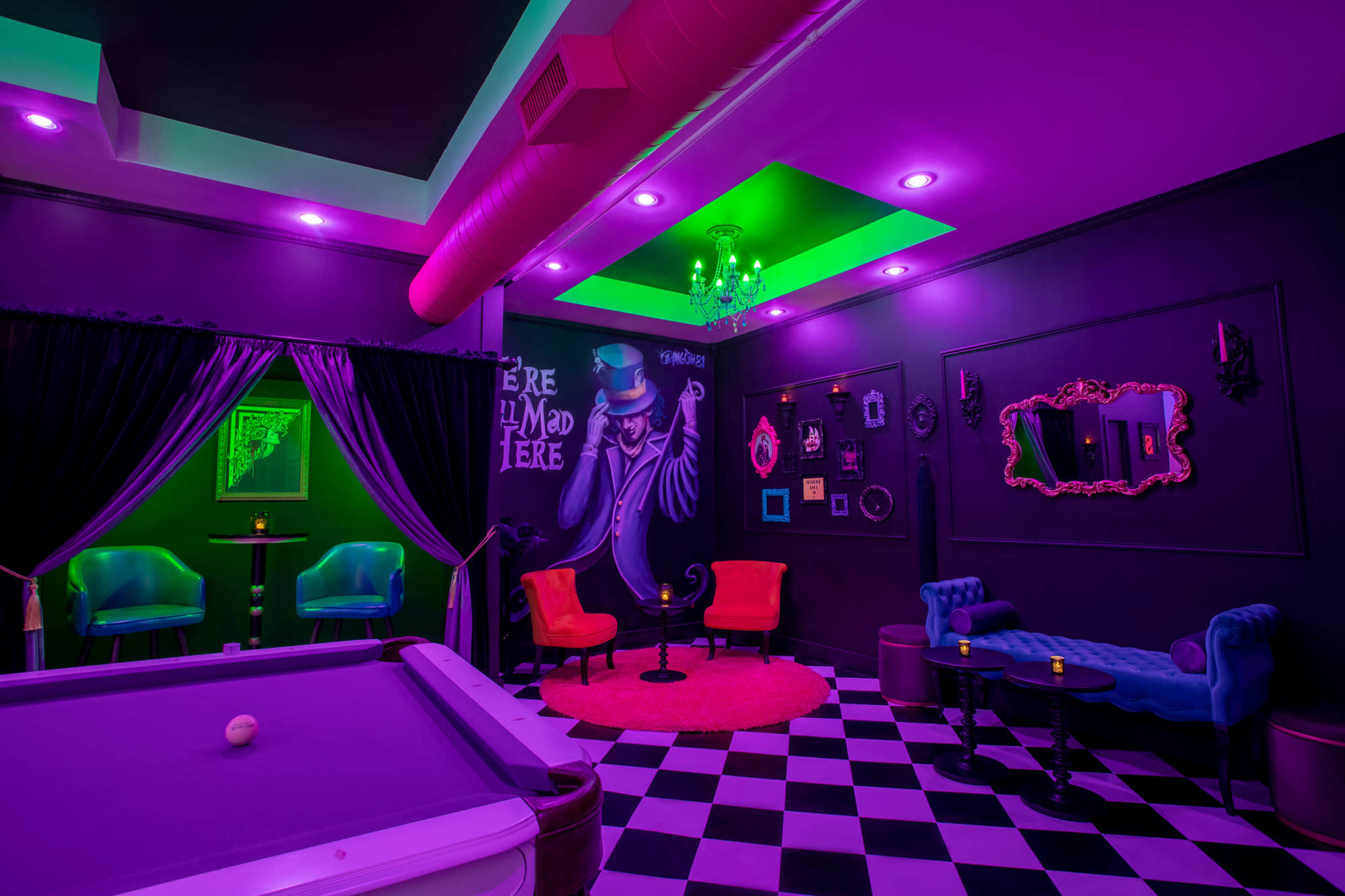 The scene features a vibrant lounge with purple and green lighting, a pool table, and stylish seating arranged around a decorative wall.
