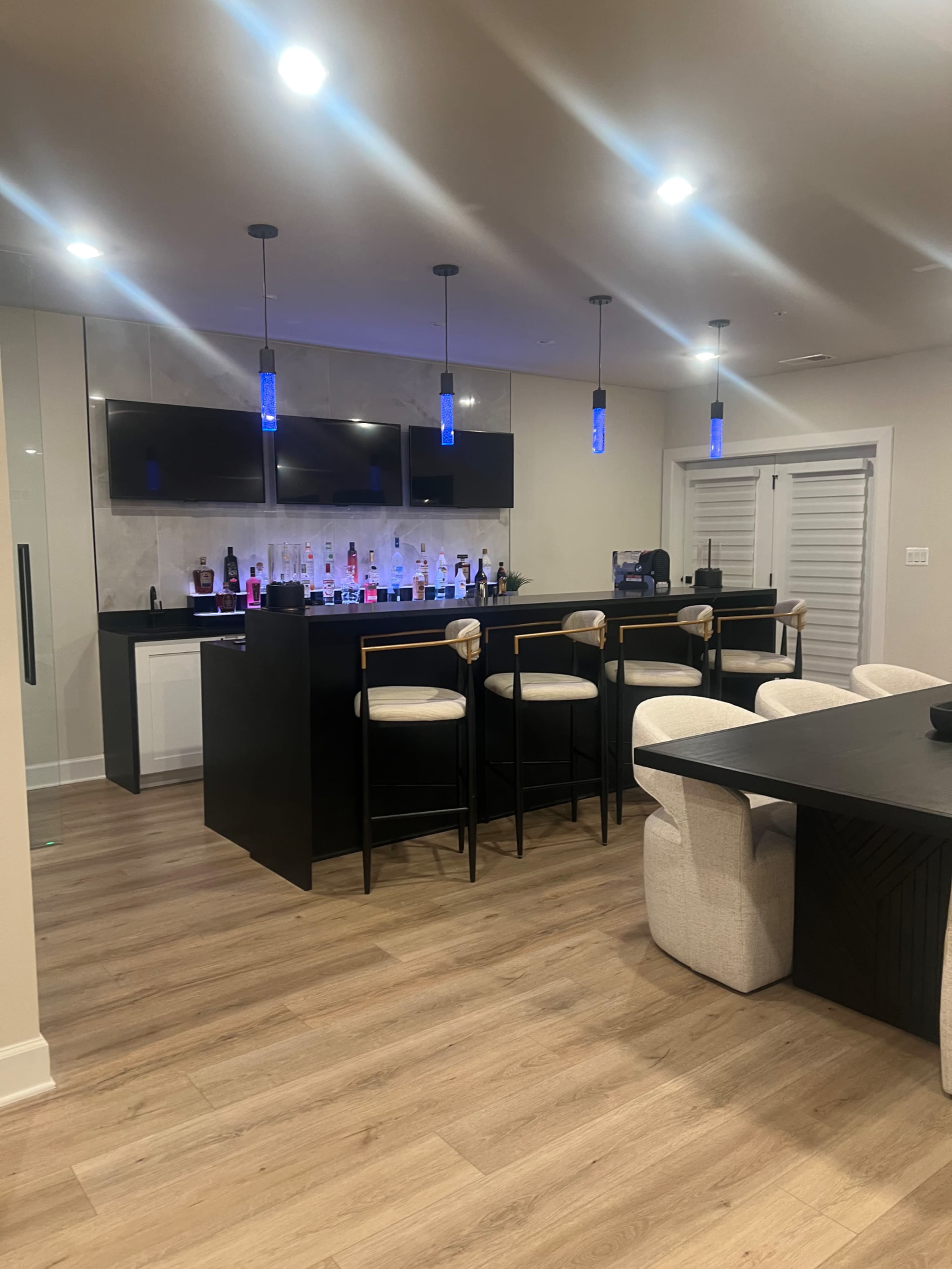 Modern Luxury Basement Lounge with Sleek Wine Room Image in Greater Upper Marlboro, Bowie, MD