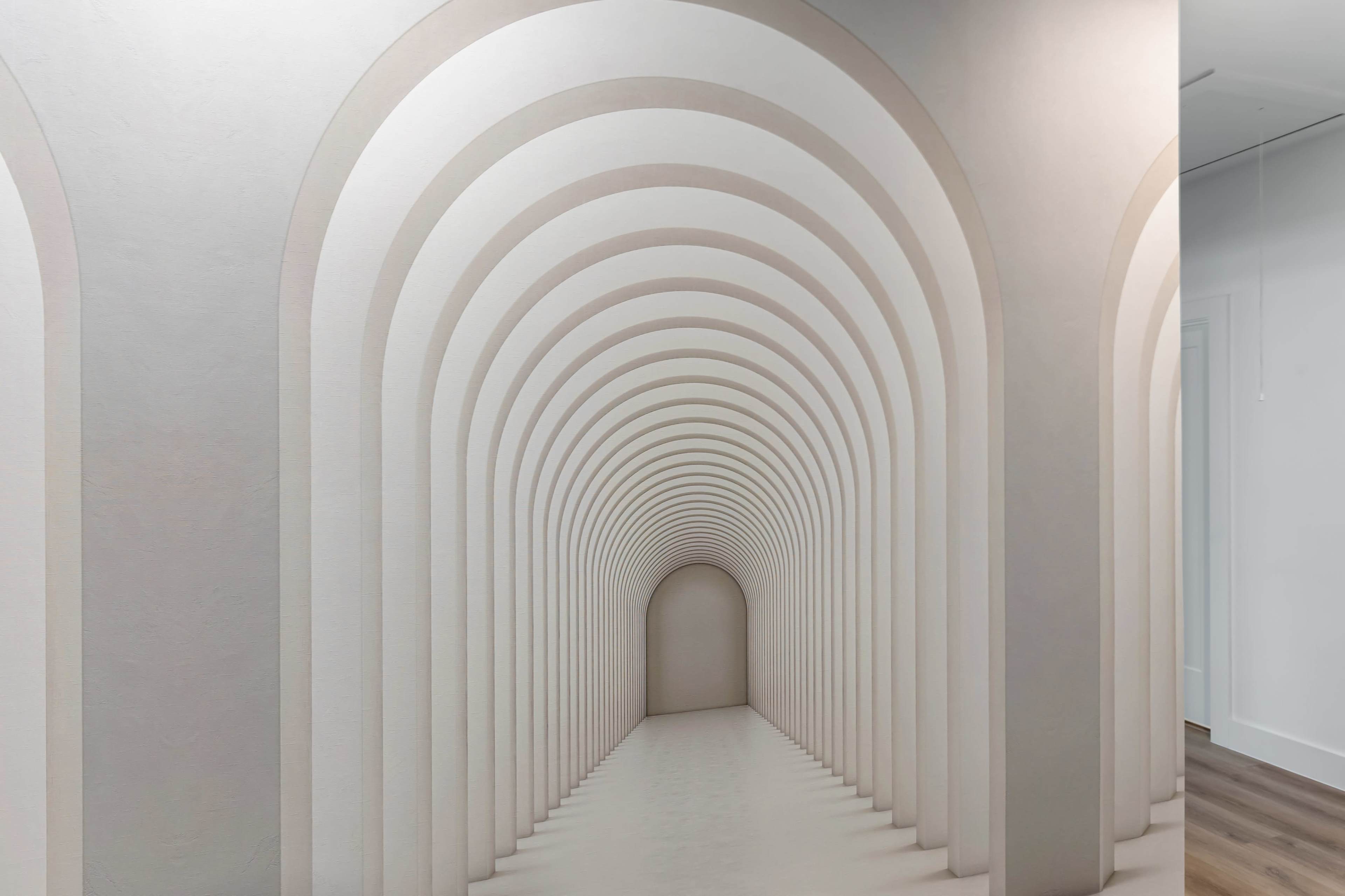 The image features a series of patterned arches painted in soft colors, creating an illusion of depth along a wall.