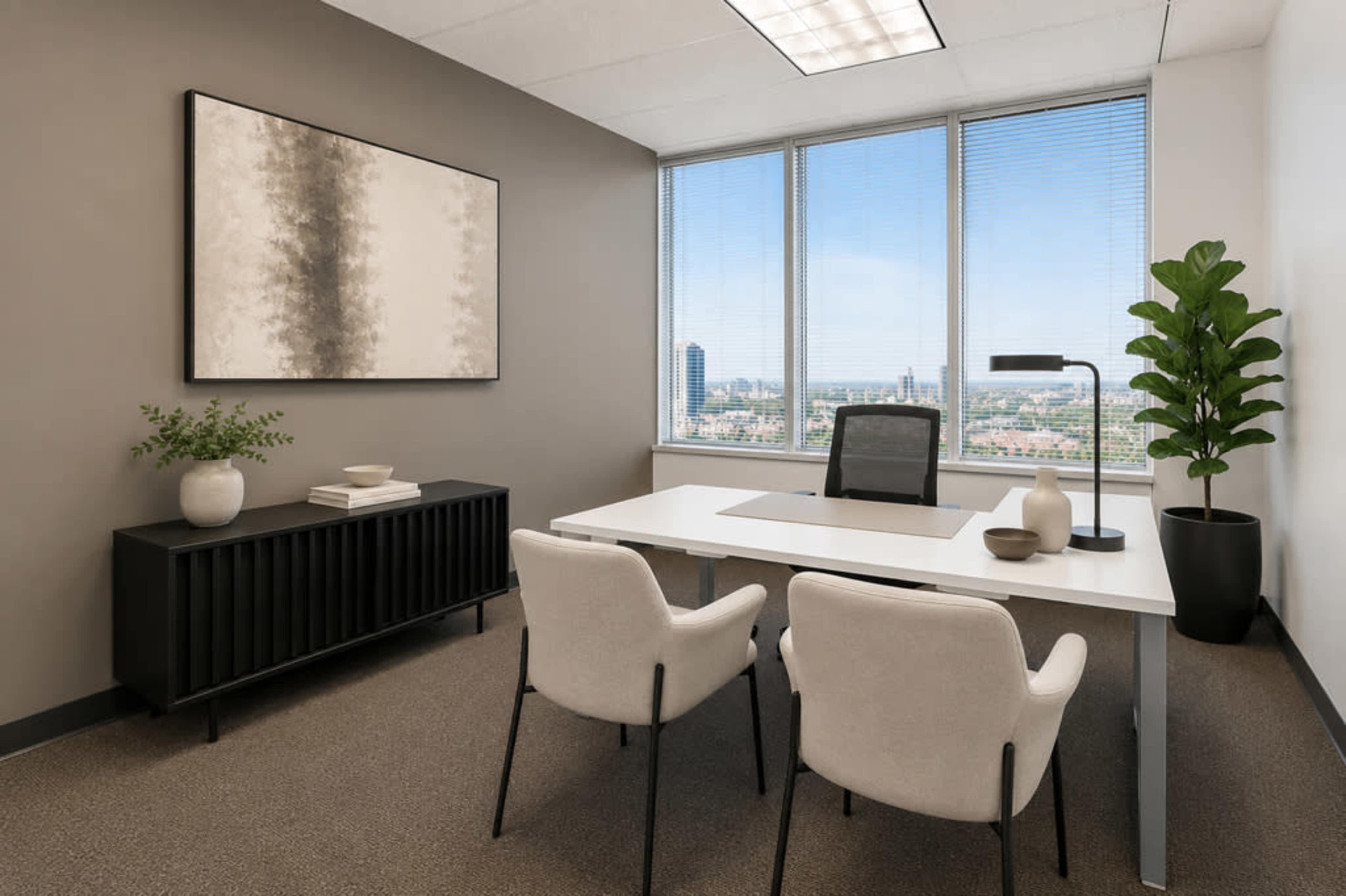 The image shows a modern office space with a white desk, two chairs, a potted plant, and large windows offering a view of a city skyline.