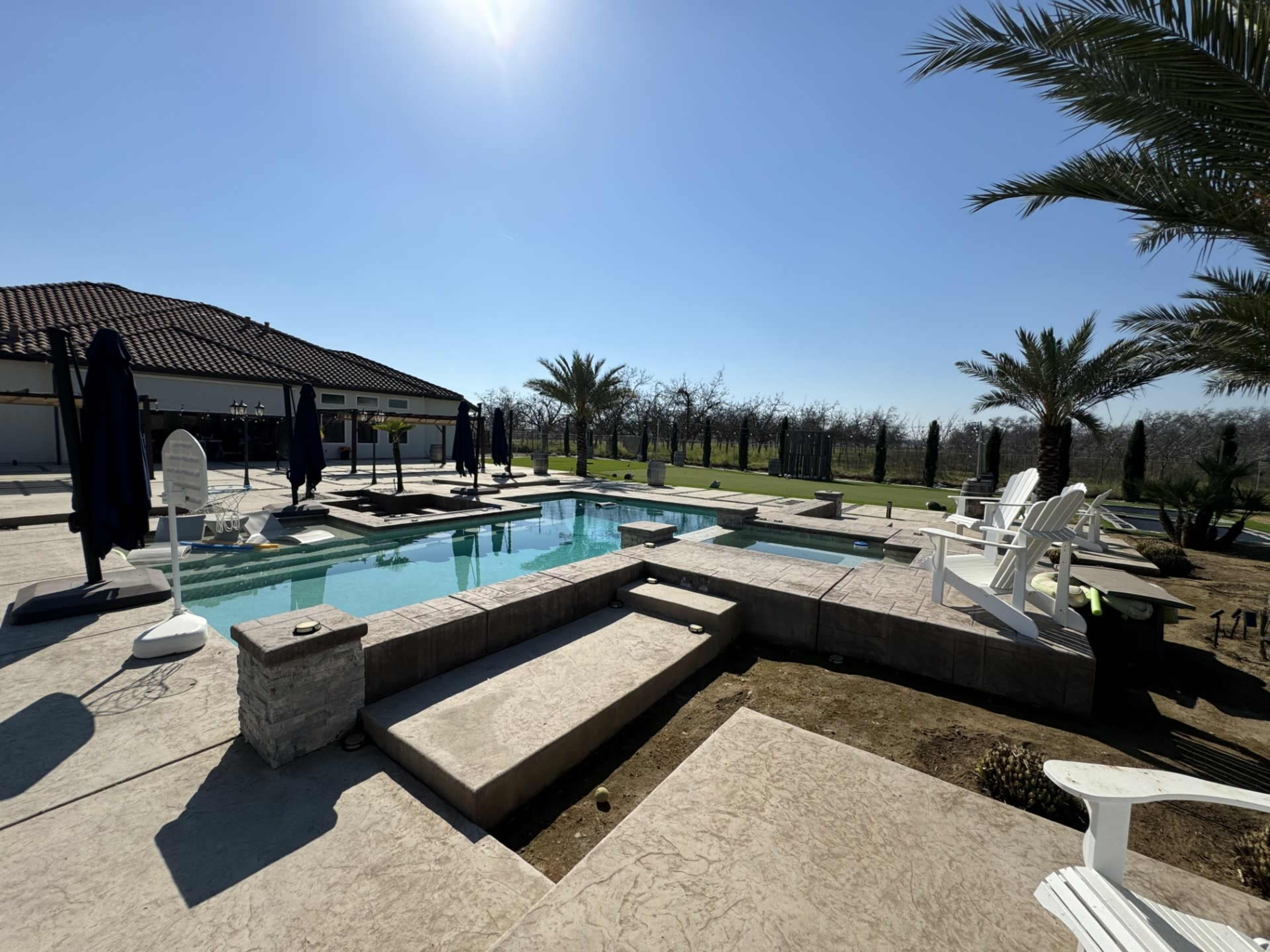 Massive garage-style shop with beautiful custom pool and mini golf Image in , SANGER, CA