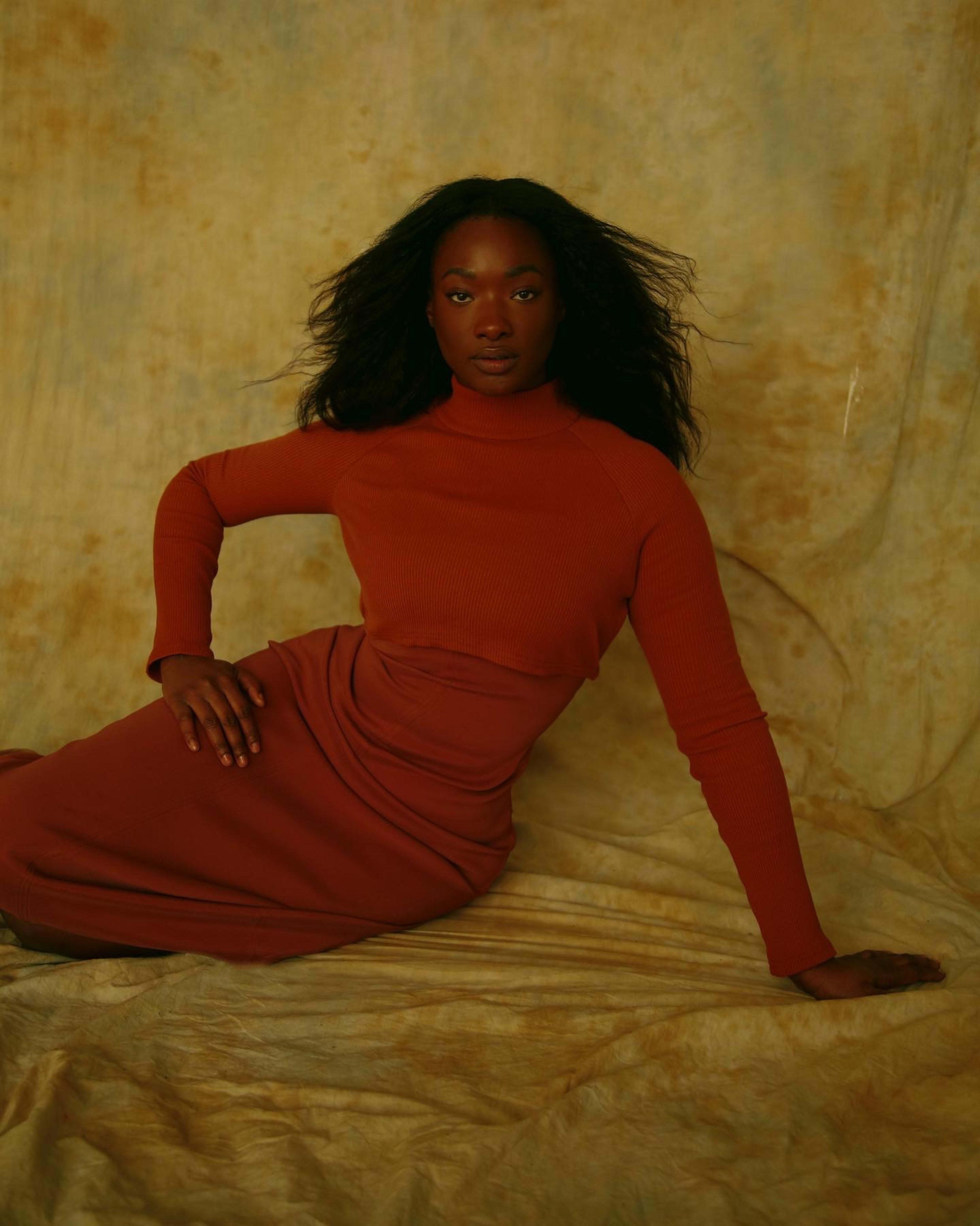 A fashion photo shoot of a woman in red.