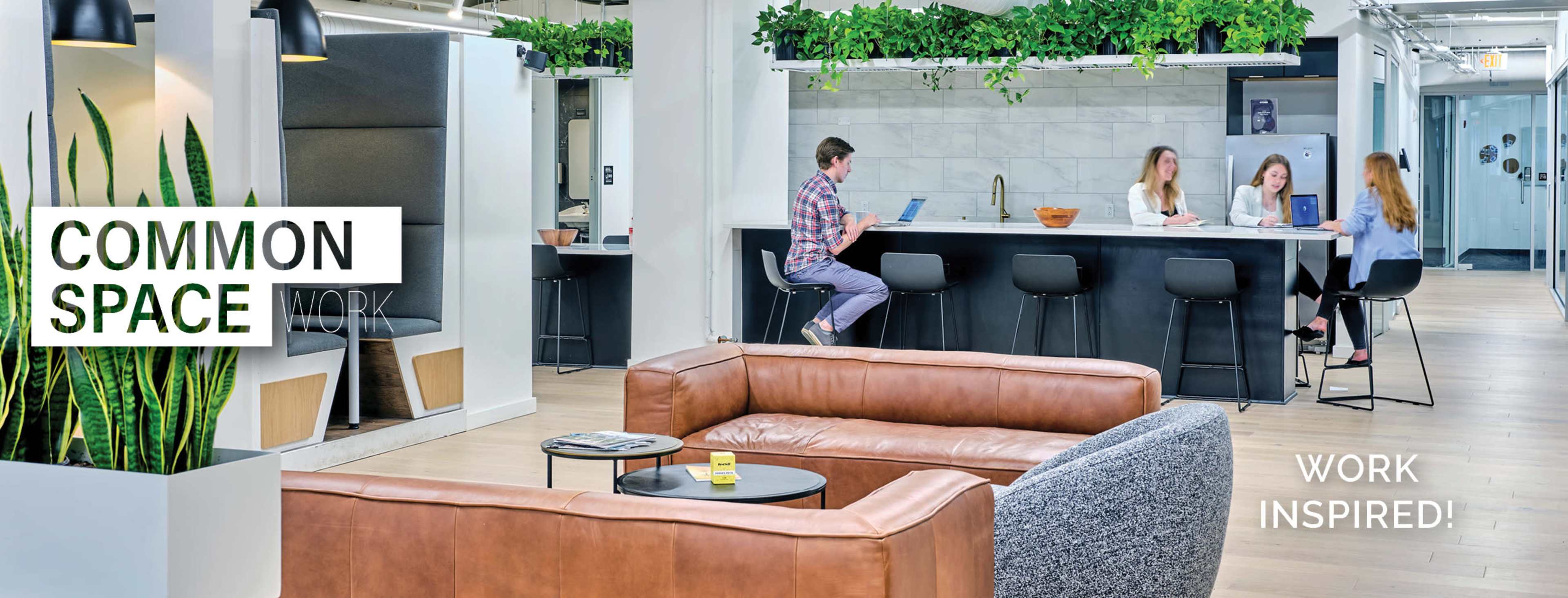 The image shows a modern common workspace featuring a cozy seating area, a bar with high stools, and people collaborating at a table in an open layout.