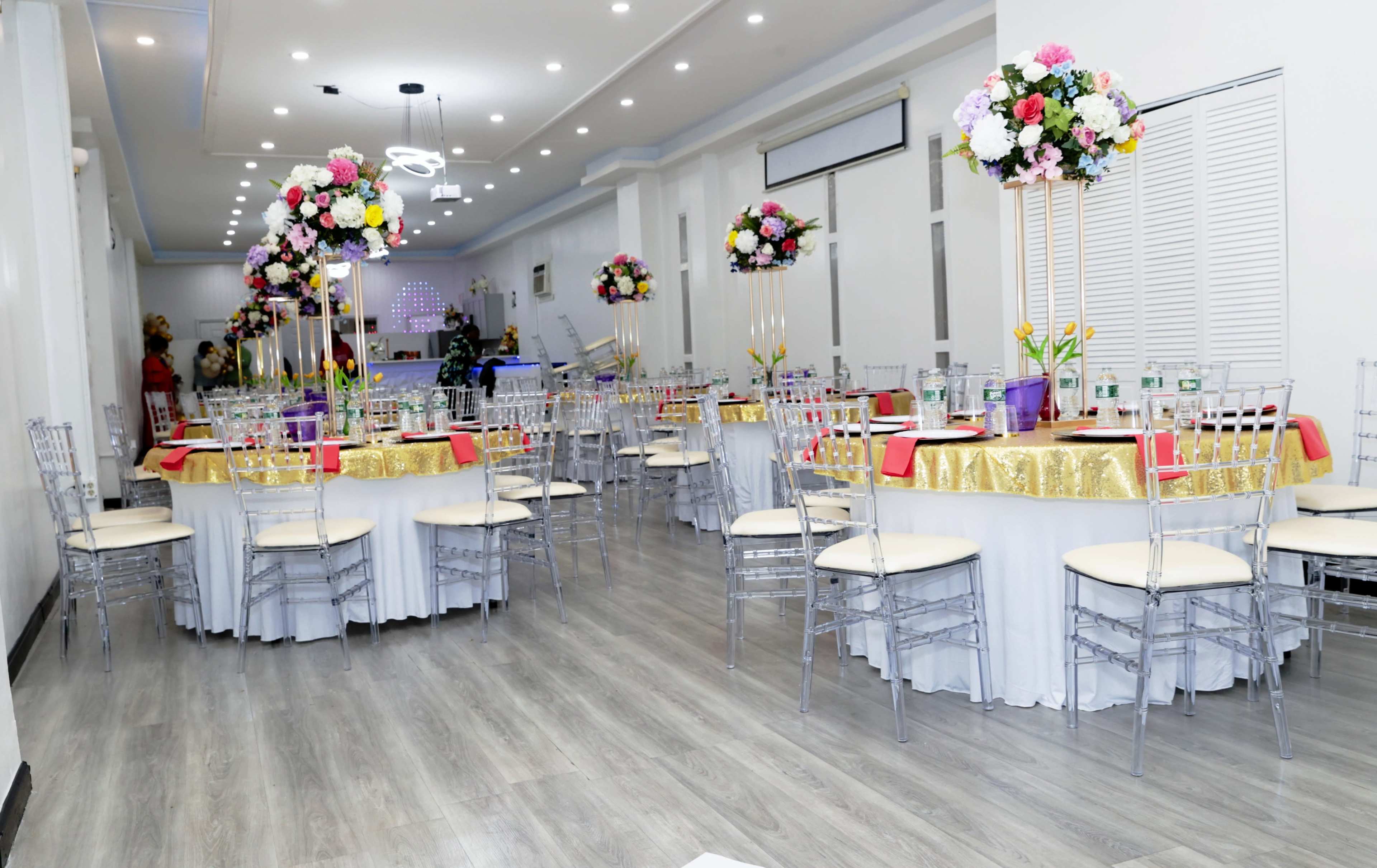 An all white  sAtunning Premier Event Venue with Accent and Flower Walls. Image in Jamaica, Queens, NY