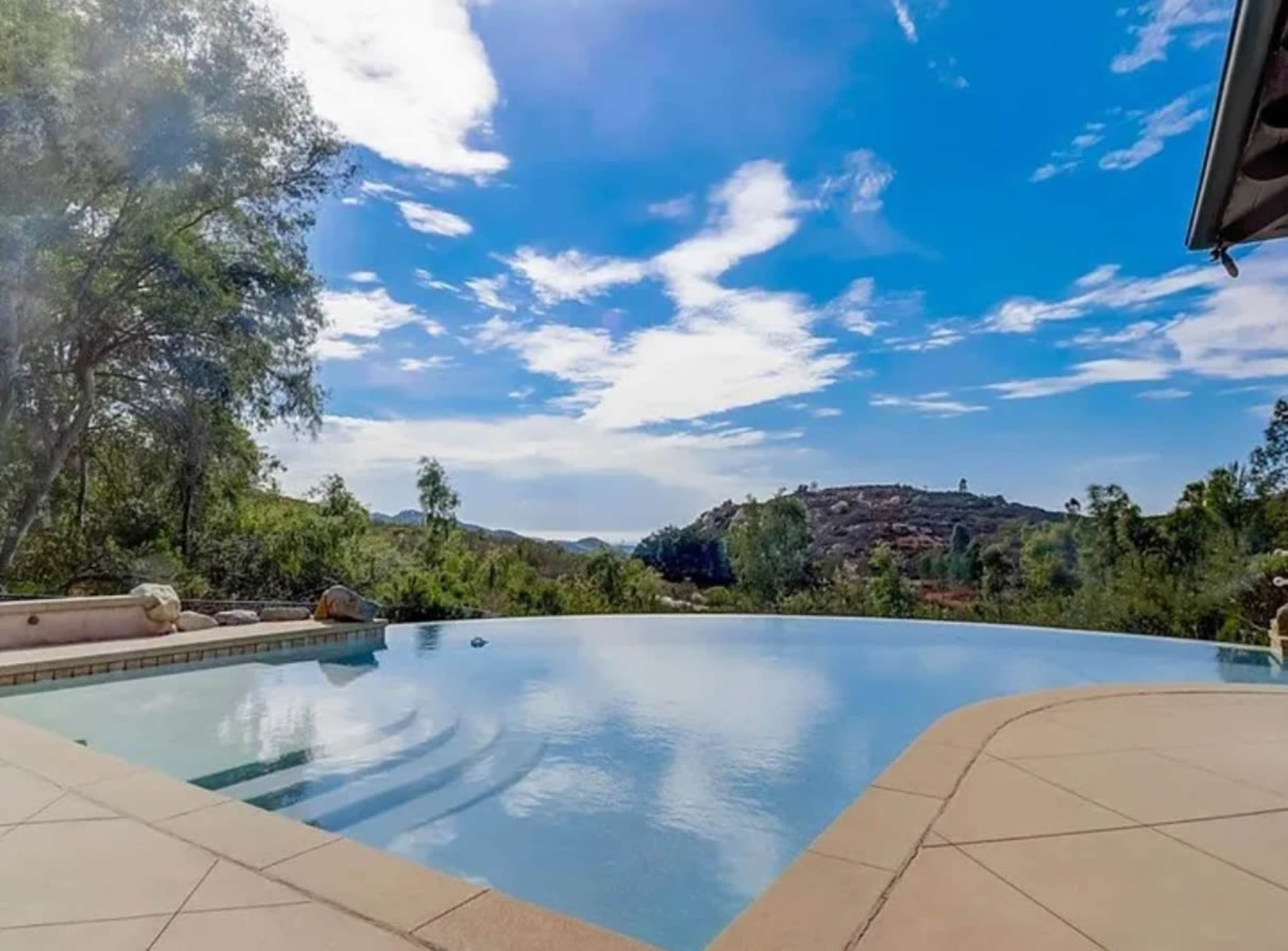 Modern Outdoor Pool Area with Golden Hour Views Image in Hidden Meadows, Escondido, CA