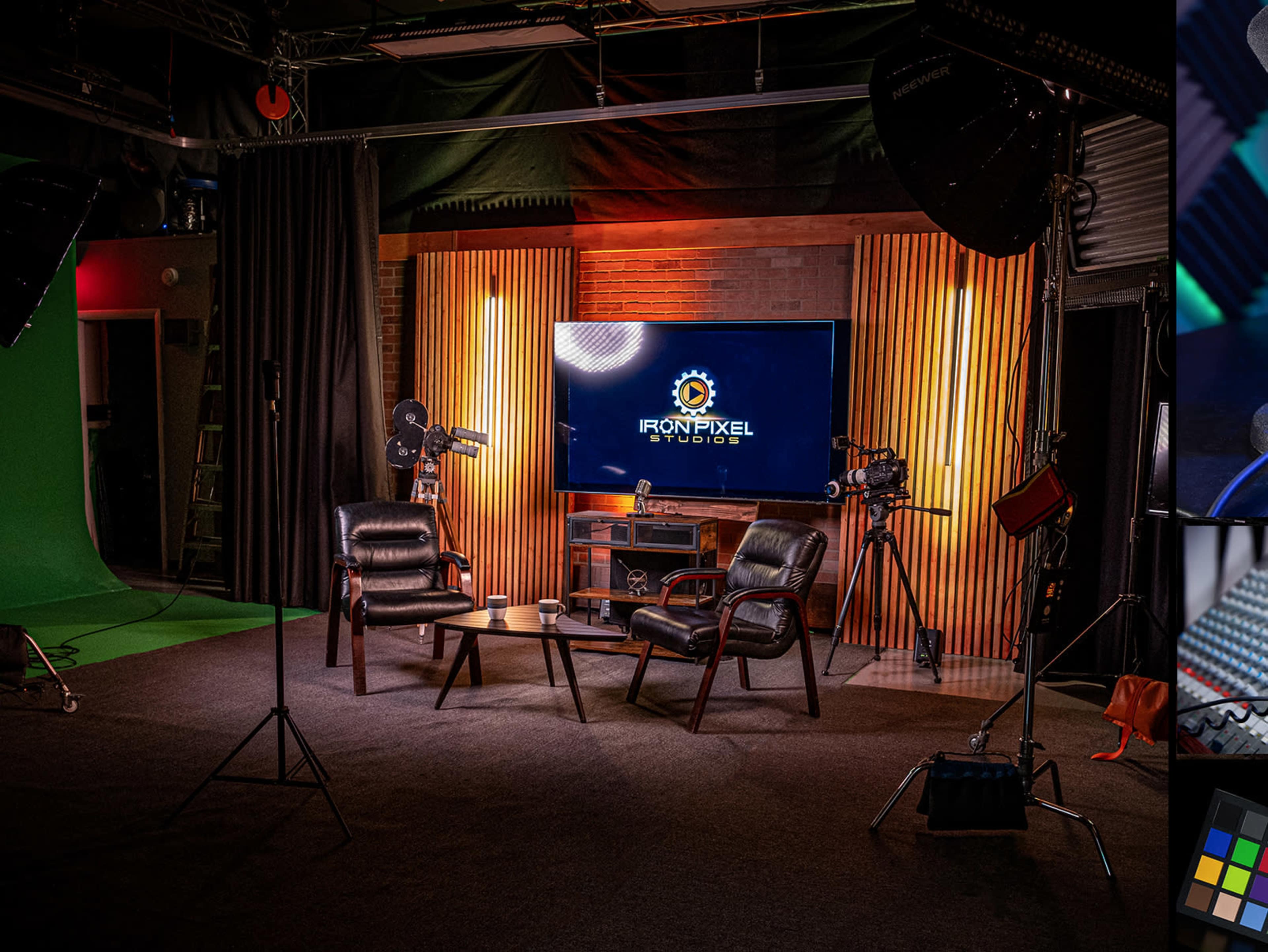 The image shows a well-lit studio setup featuring two leather chairs facing a television screen displaying the logo of Iron Pixel Studios, with additional lighting and equipment in the background.