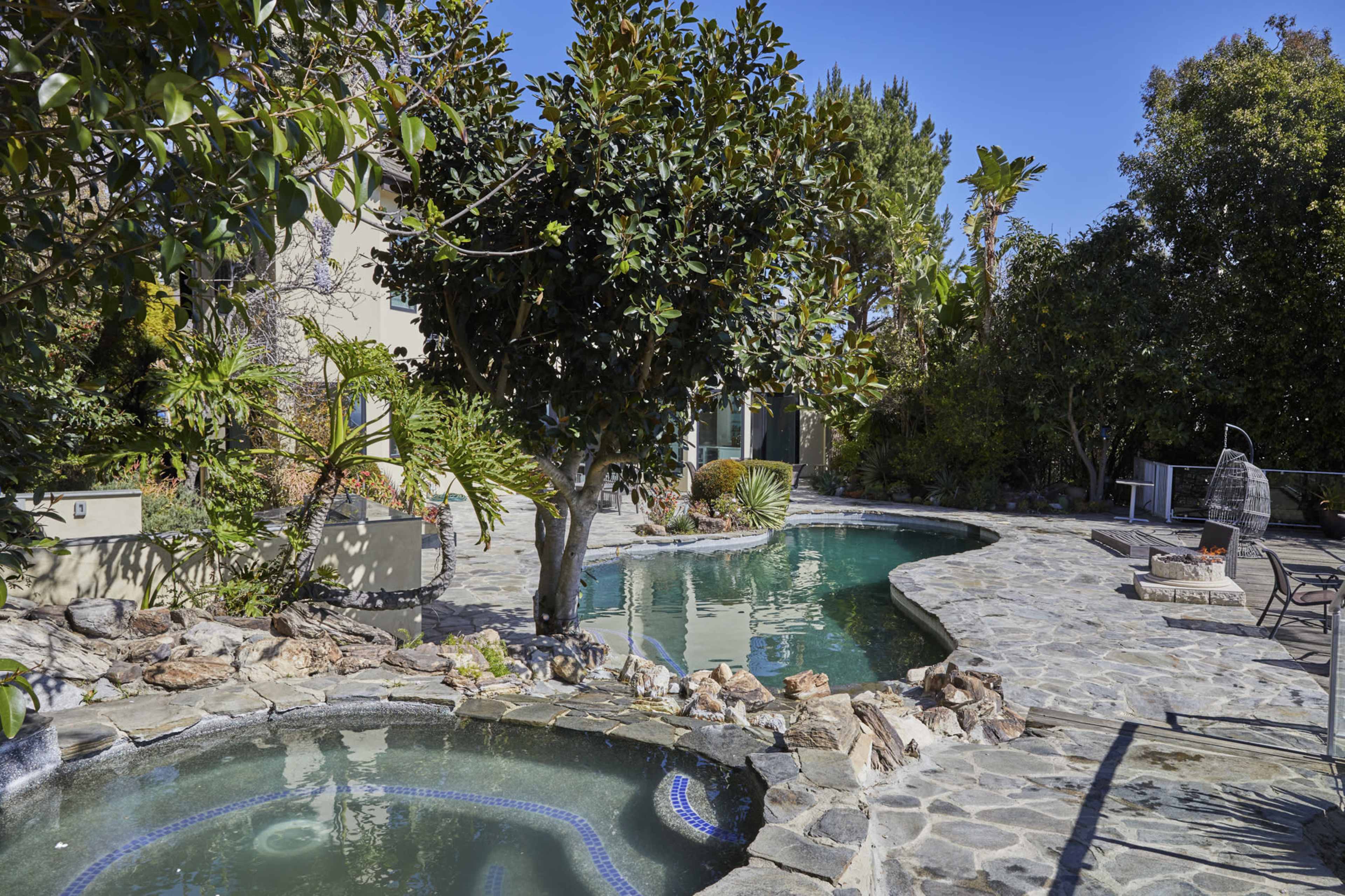 Stunning Bel Air mansion offering breathtaking views of West Los Angeles, rolling hills, majestic mountains, lush greenery, and the sparkling Pacific Ocean Image in Beverly Crest, Los Angeles, CA