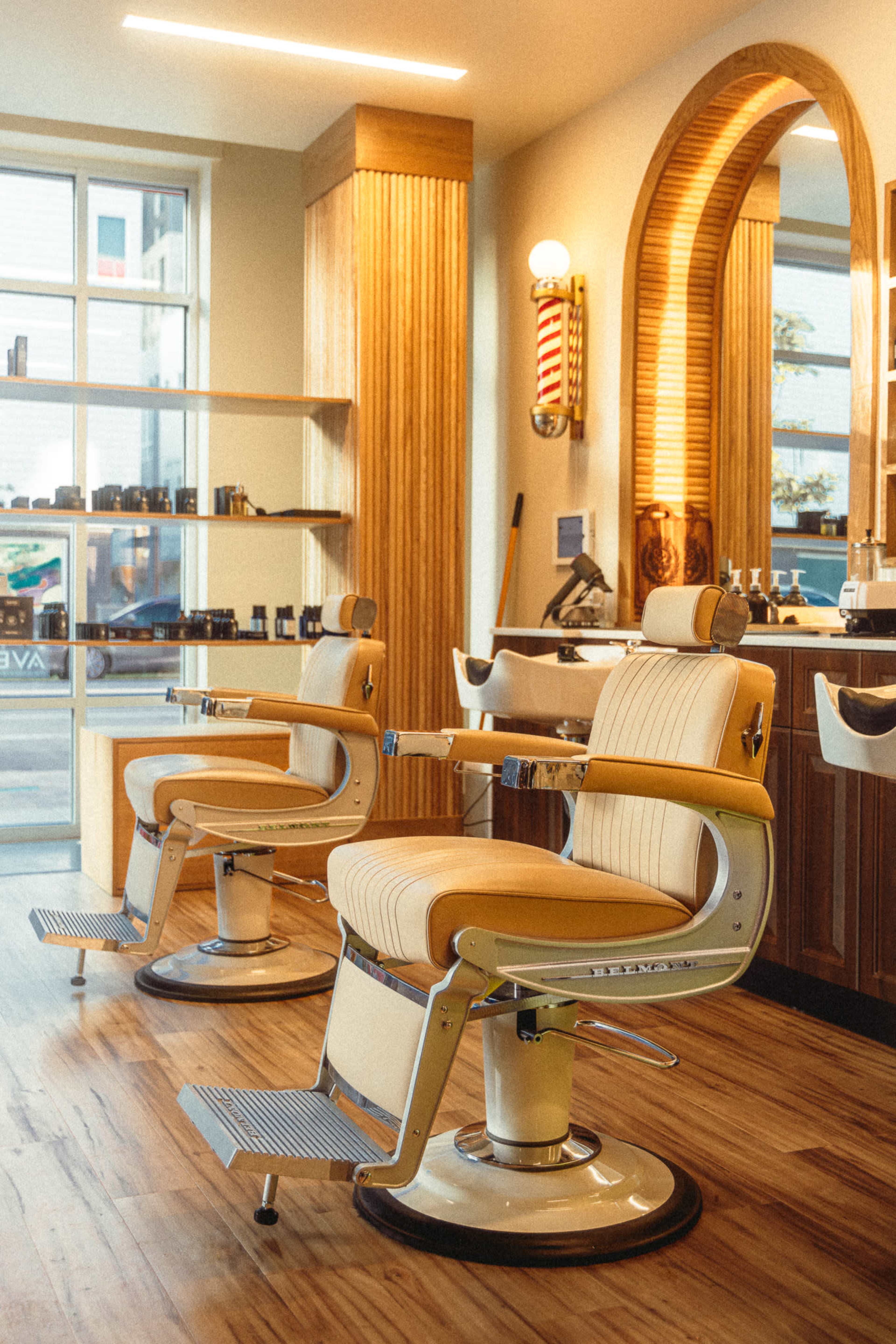 Stylish Barbershop in RiNo — Curved White Wall, Photography Lighting, and Modern Vintage Vibe Image in Five Points, Denver, CO