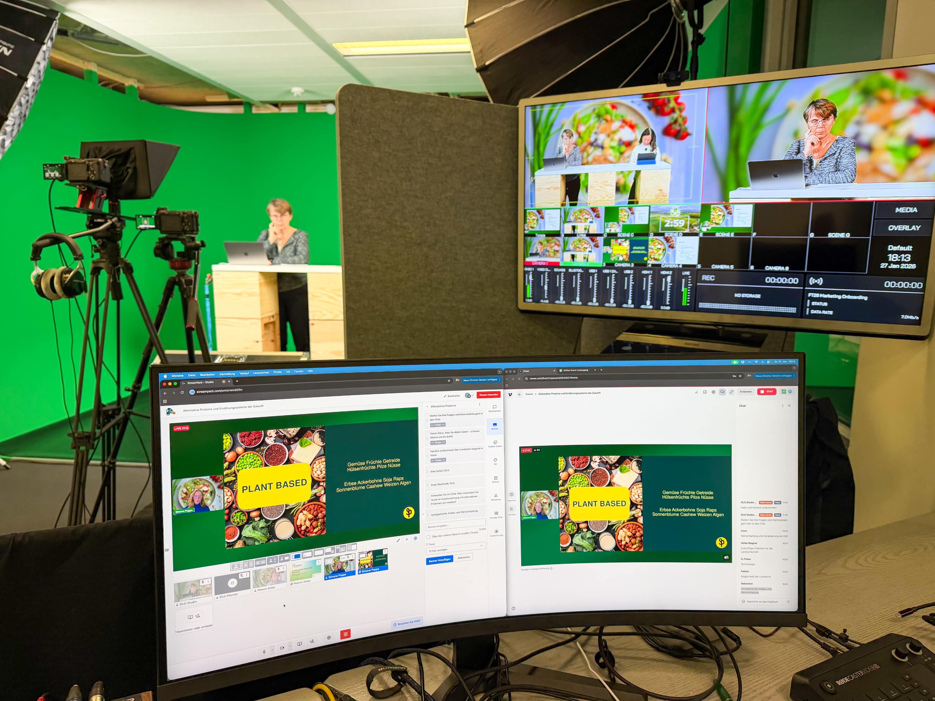 A woman presents in front of a green screen while multiple cameras and monitors display her presentation about plant-based food.