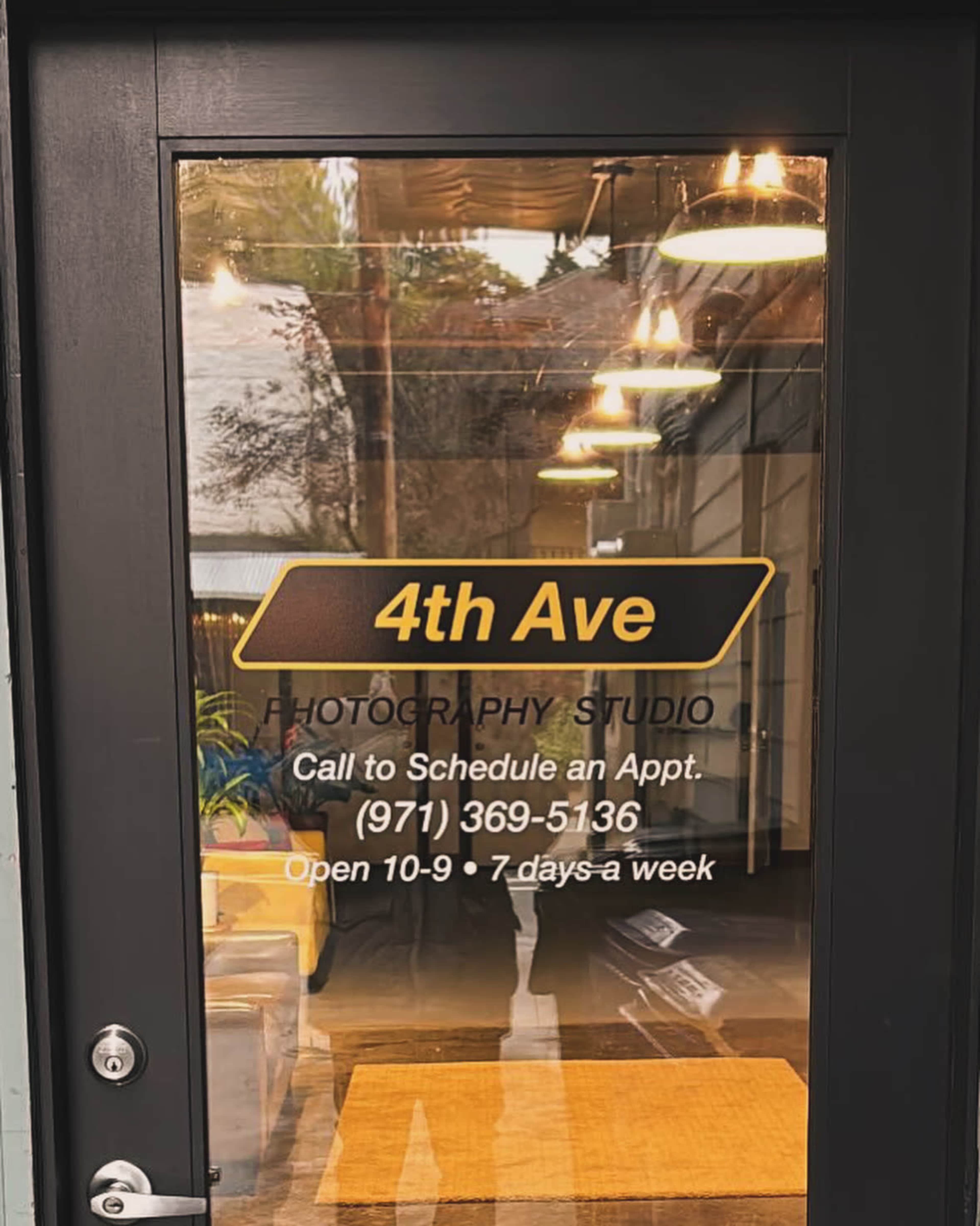 The door of a photography studio features the name "4th Ave" along with contact information and business hours.