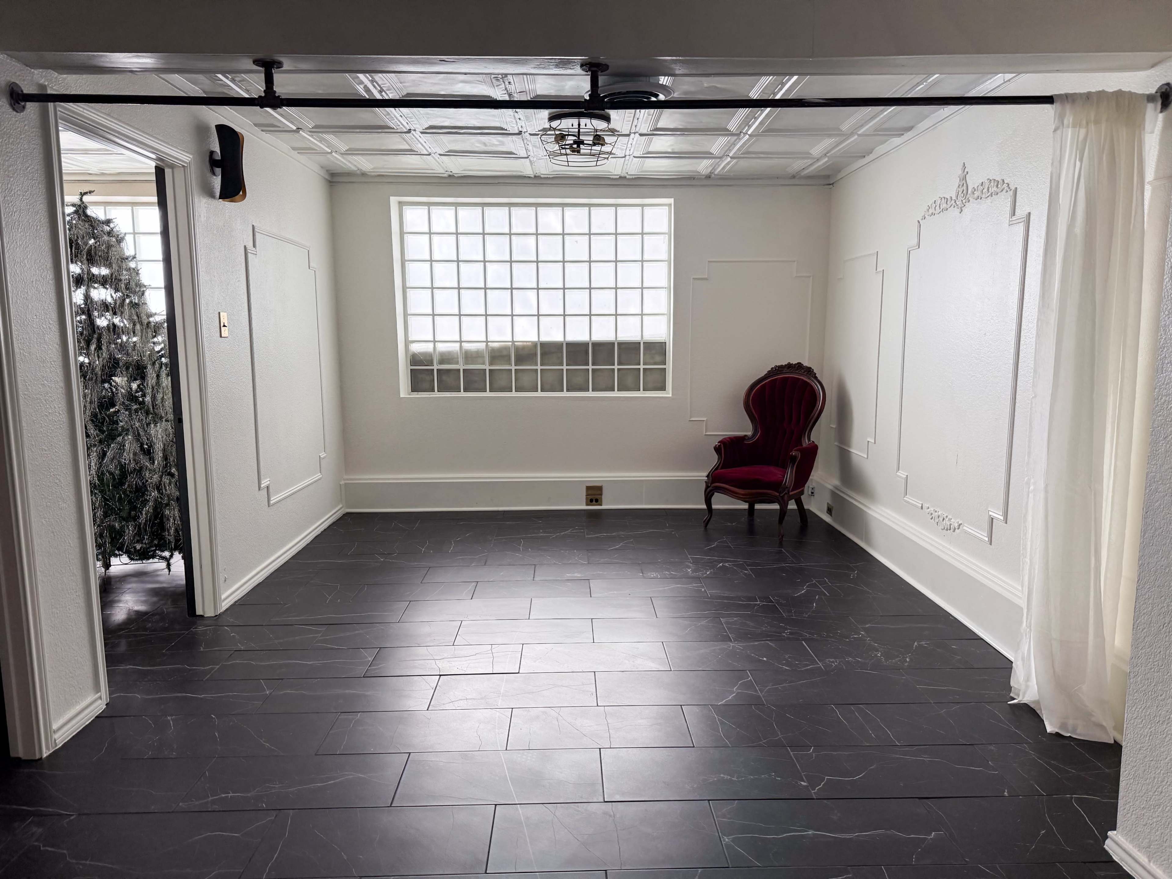 The Parisian Parlor at Archive Haus | a Natural Light all white European Style Studio Steps from the Denton Square Image in Denton, Denton, TX