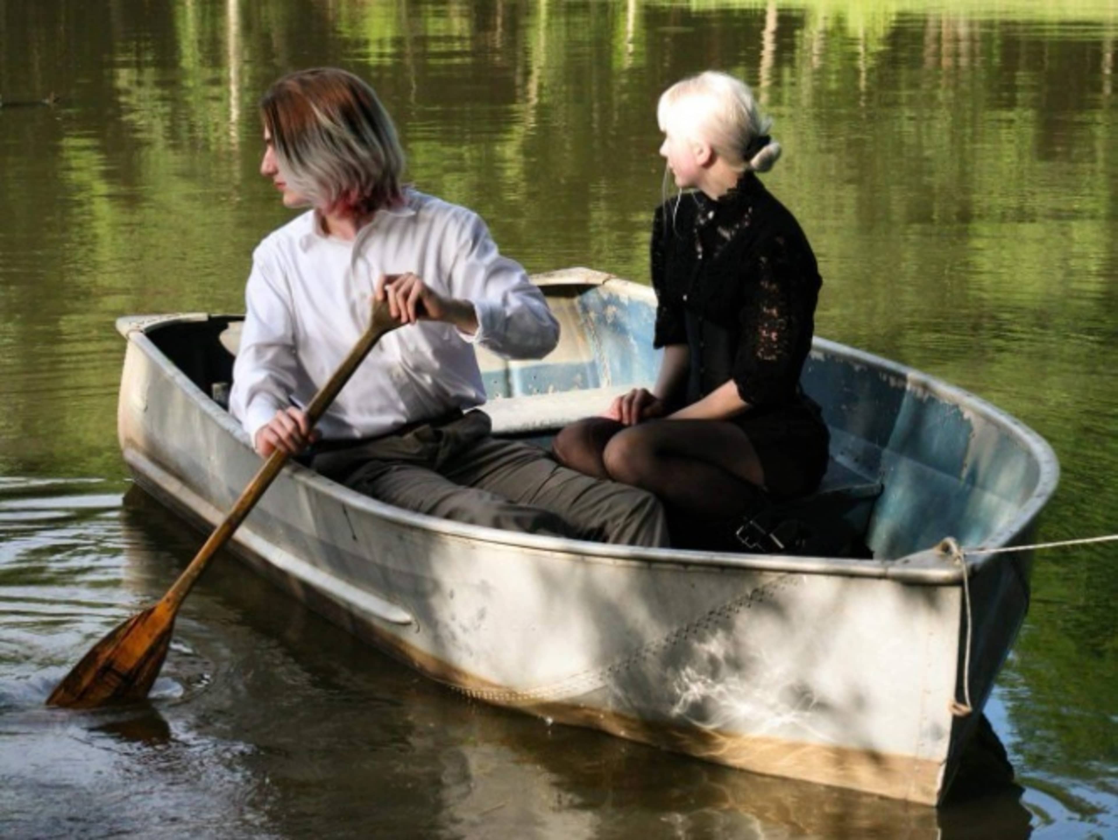 Set up row boat by pond for photos only.