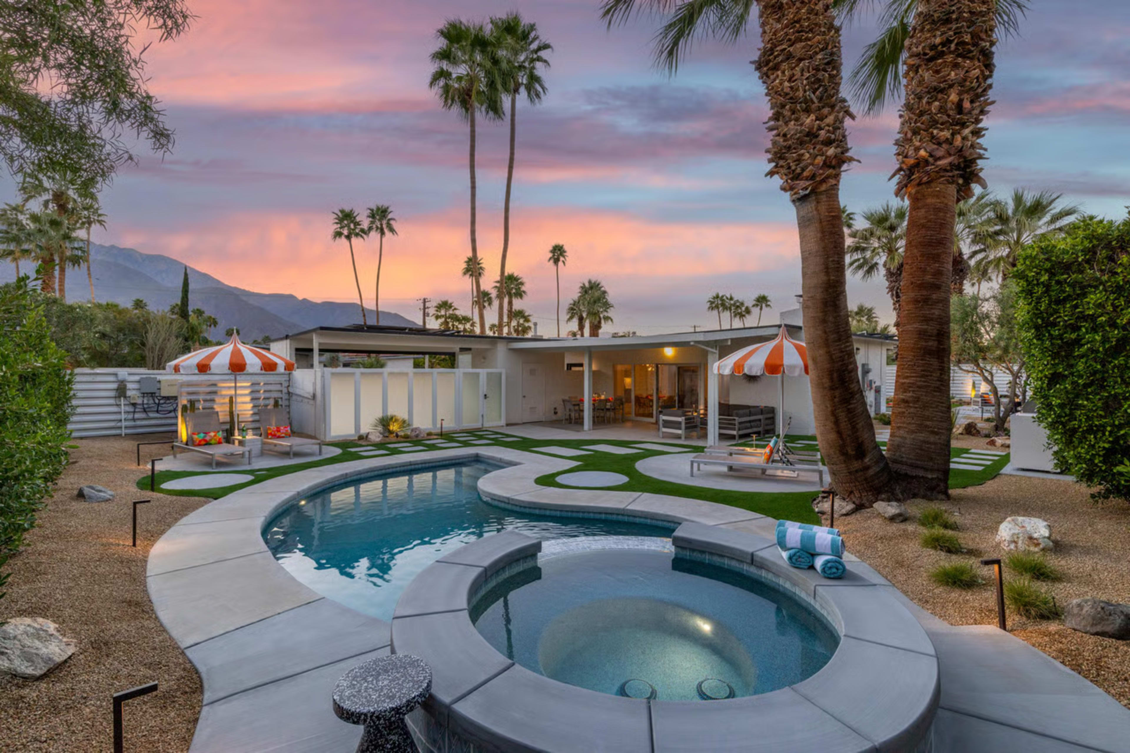 The image shows a modern house with palm trees, a circular pool, and lounge areas, set against a sunset sky.