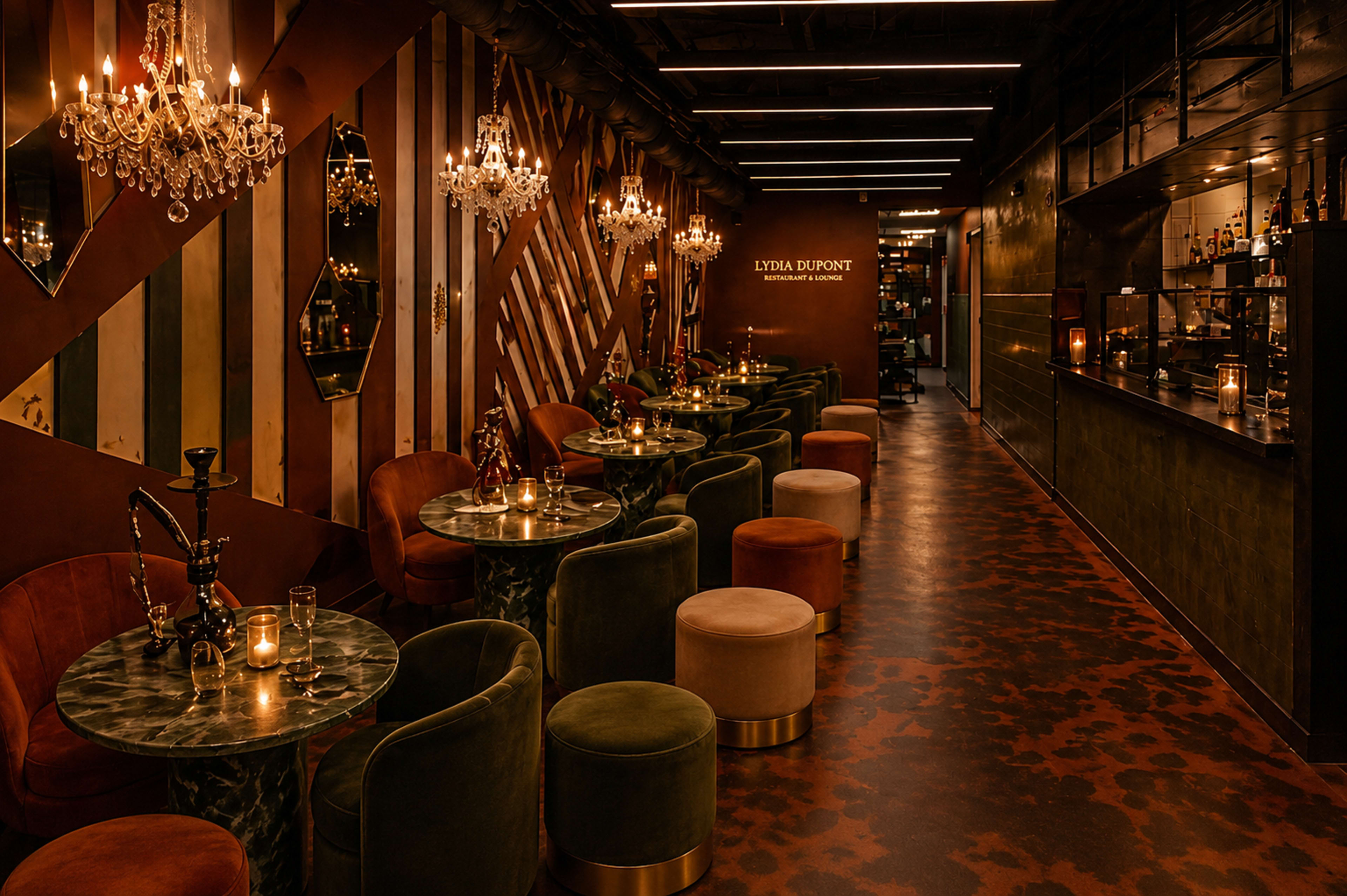 The image shows a stylish lounge with plush seating, decorative chandeliers, and a well-stocked bar in a contemporary interior design.
