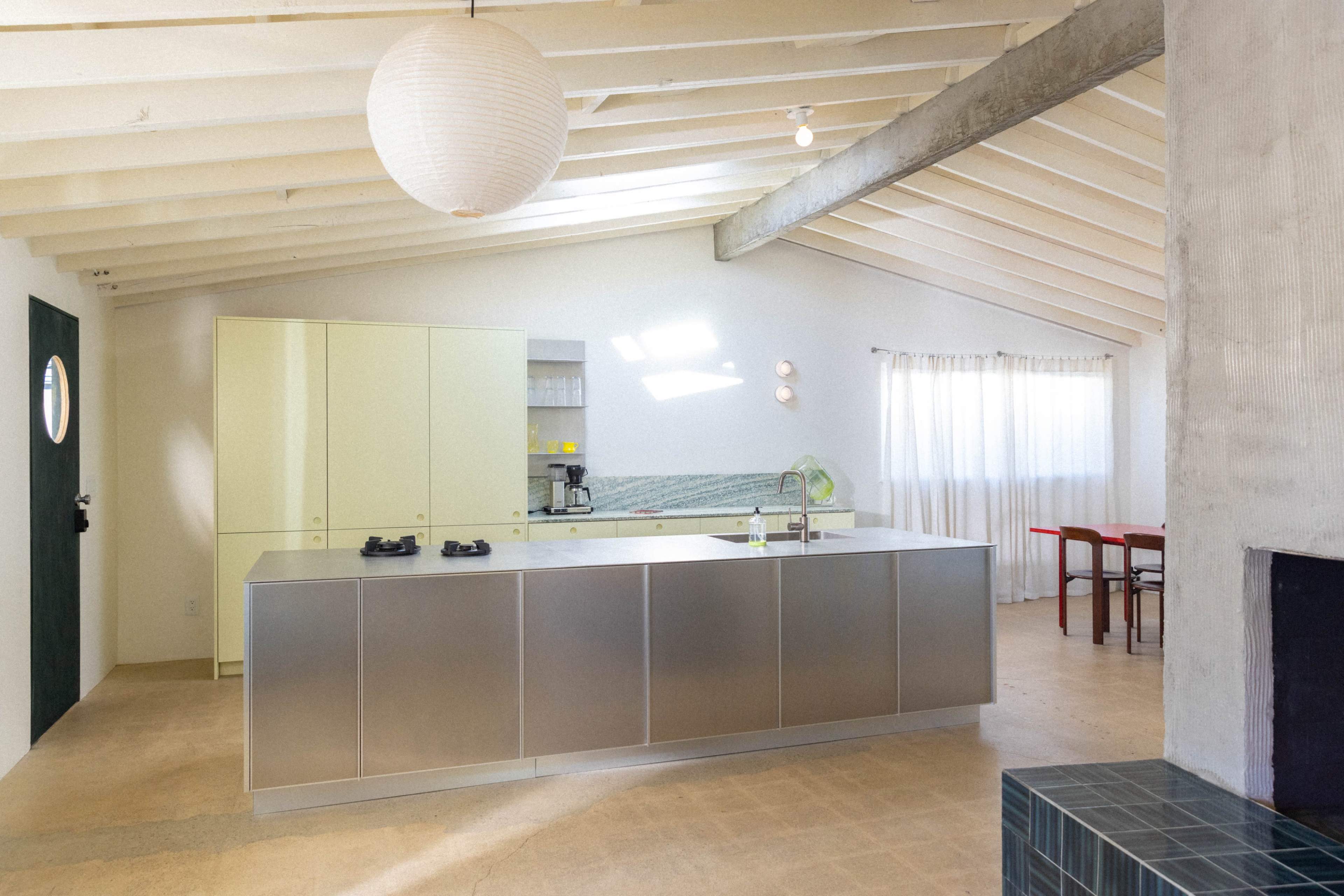 Naturally lit Coastal Ranch with danish kitchen, stainless steel and colorful plywood furniture Image in College Park, Costa Mesa, CA