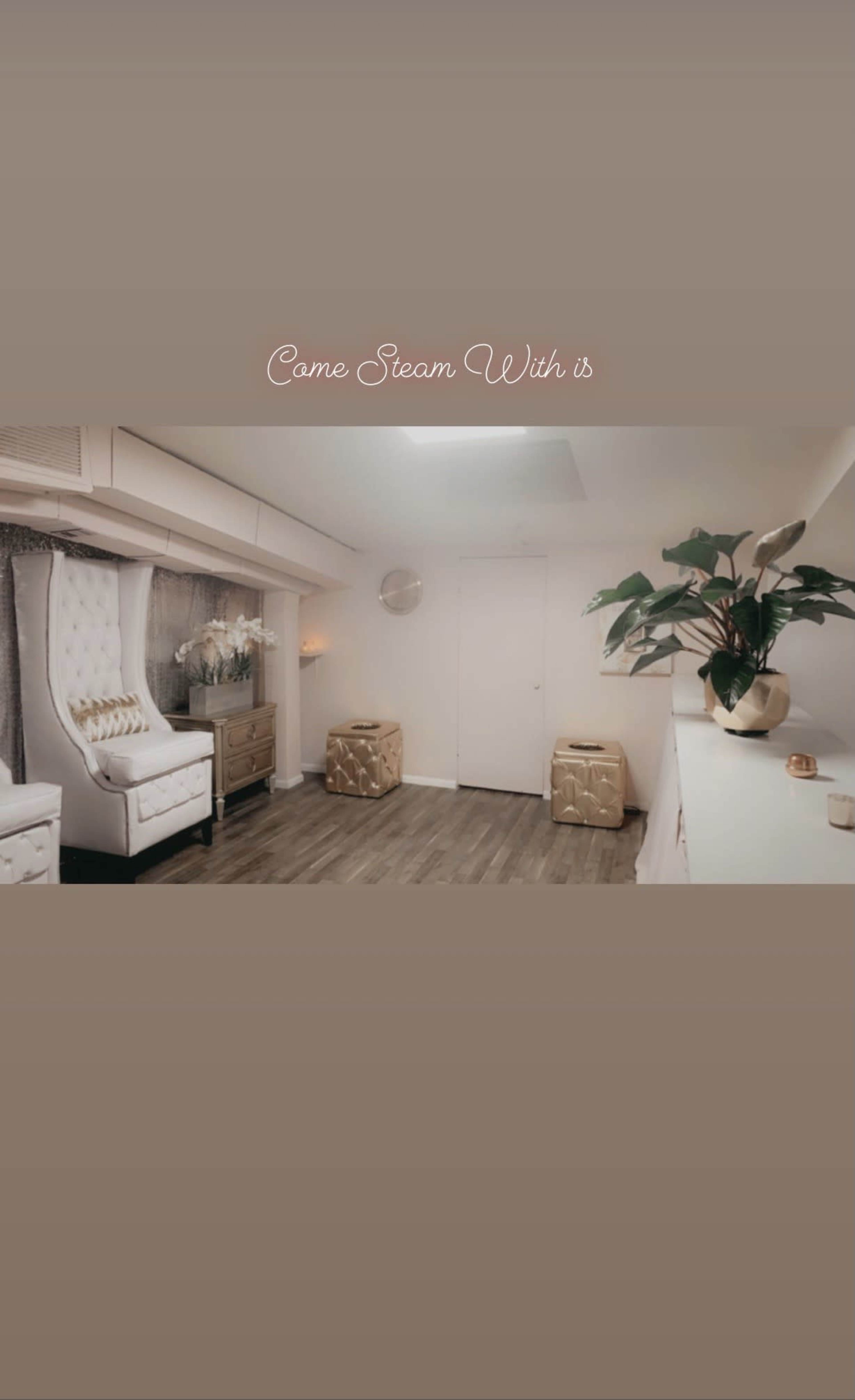 A well-organized, modern treatment room featuring two white chairs, a decorative plant, and a light-colored cabinet against a wall.