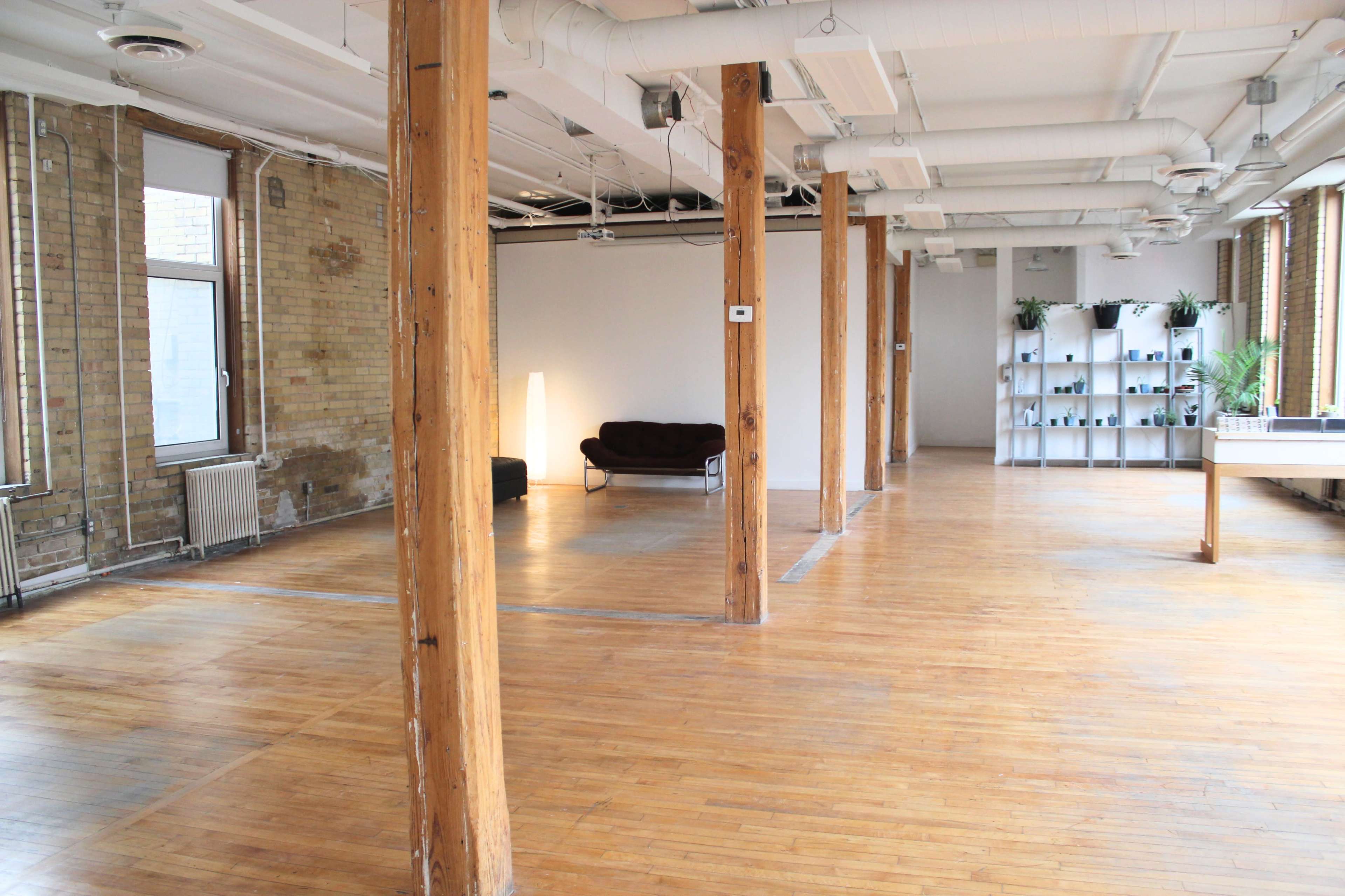 Downtown Loft with Natural Light, Brick, and Exposed Wooden Beams Image in Downtown Toronto, Toronto, ON
