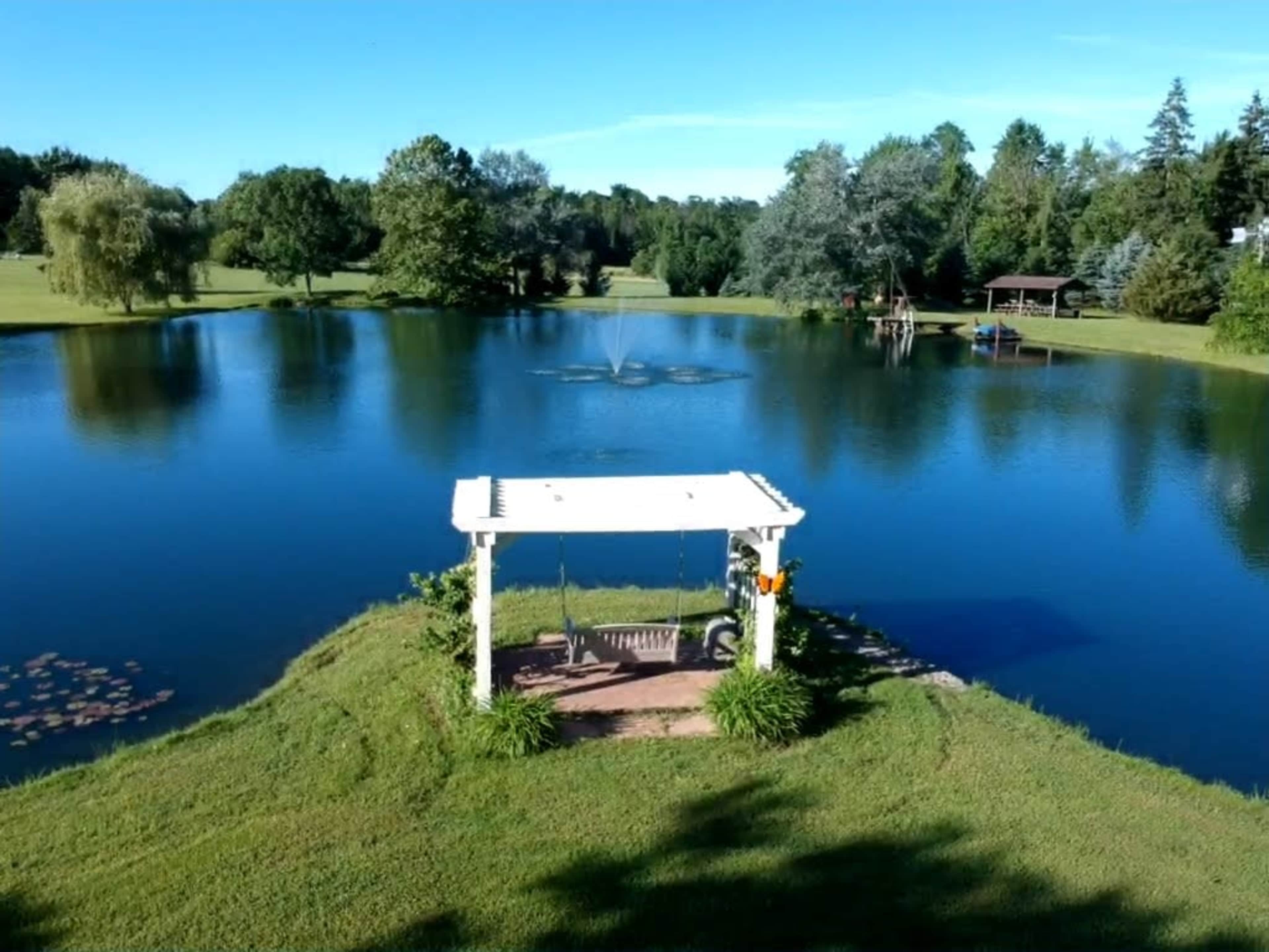 Rural Home with 1.5 Acre Pond, Park Like Setting Image in McKean Township, Erie, PA