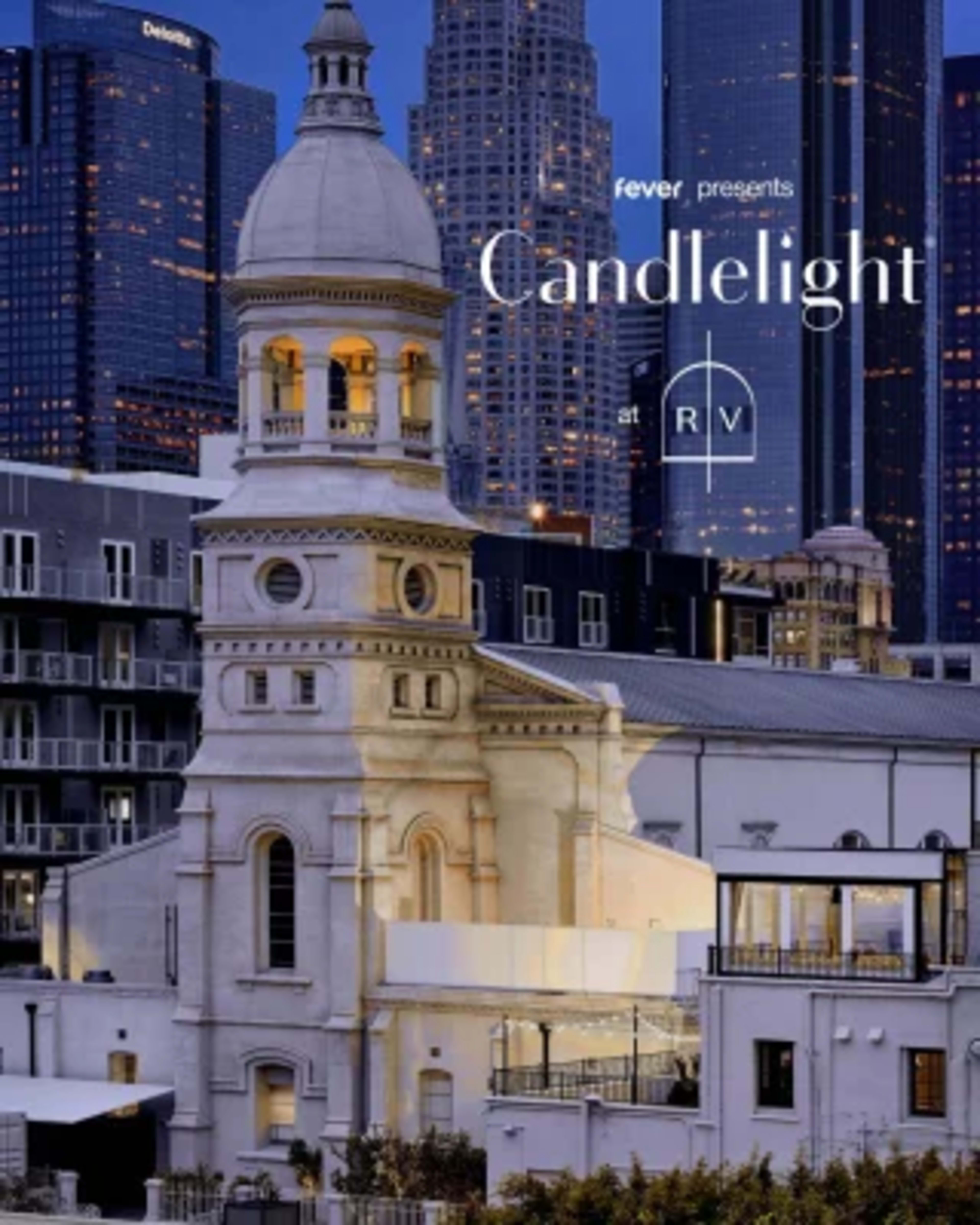 The image features a historical building with a prominent dome and clock tower in an urban setting, illuminated by evening lights against a backdrop of city skyscrapers.