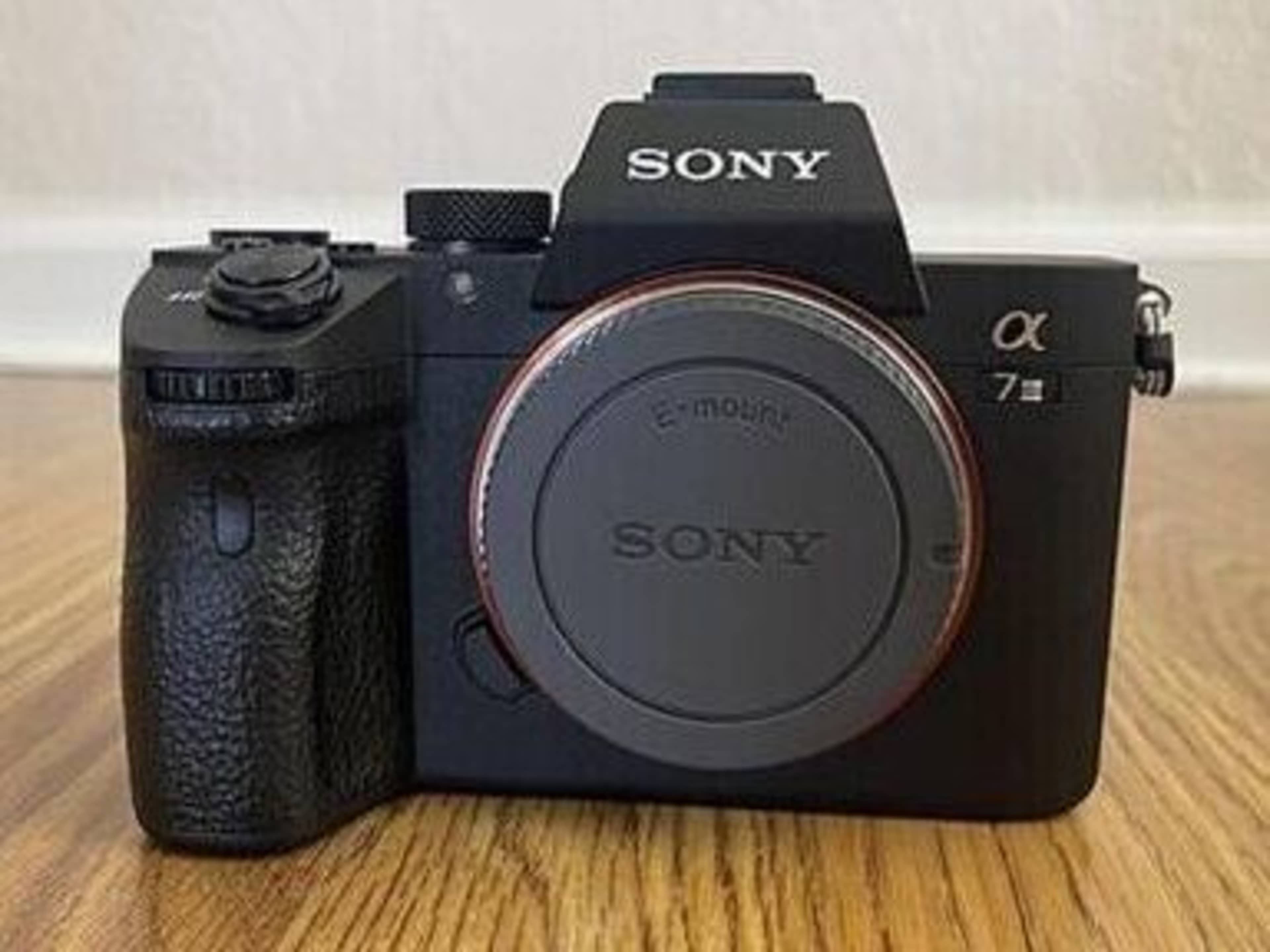Sony A7iii DSLR Camera with lens and microphone
