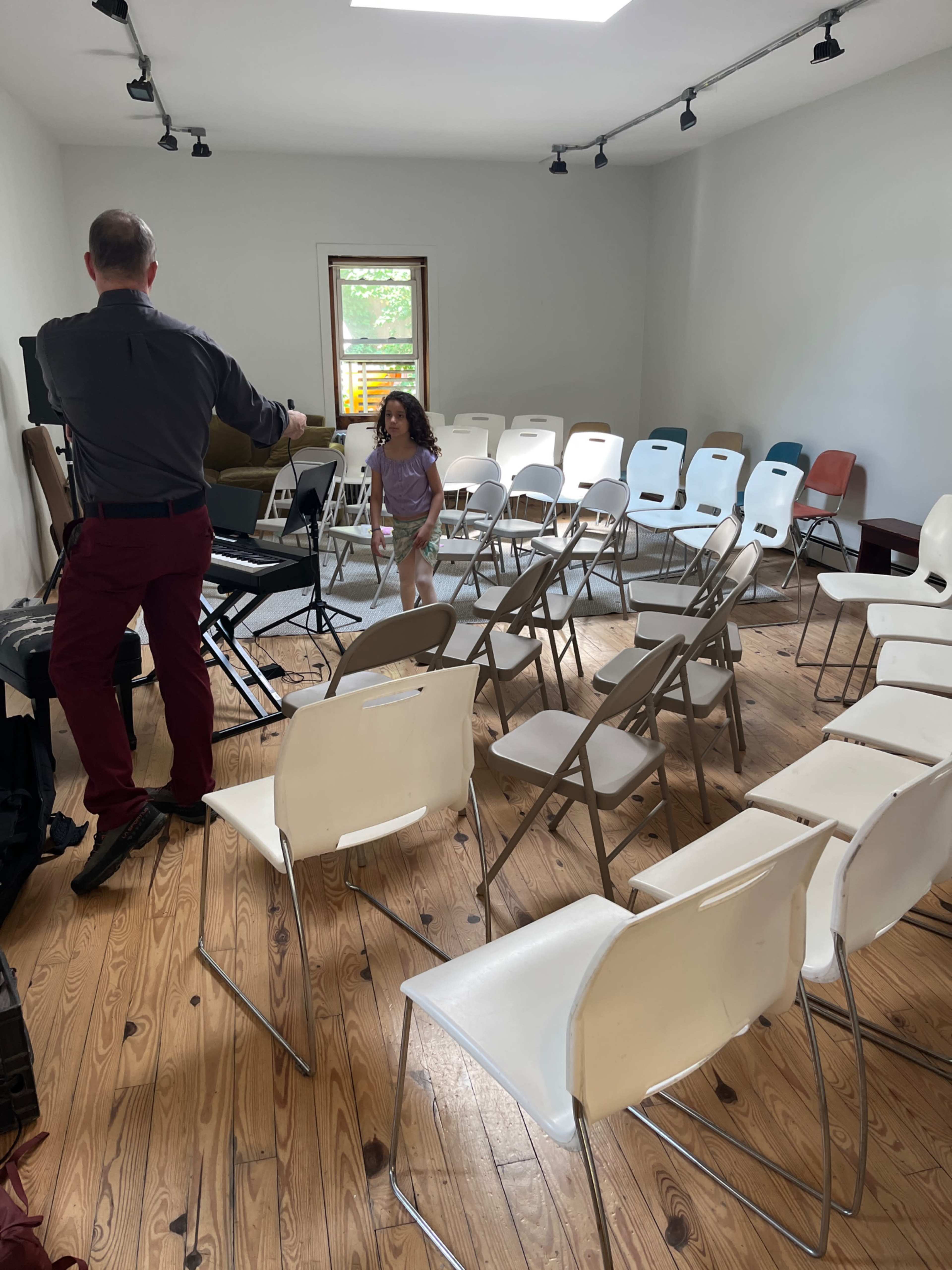 Large open room with gallery lighting and adjacent full kitchen. Image in Windsor Terrace, Brooklyn, NY