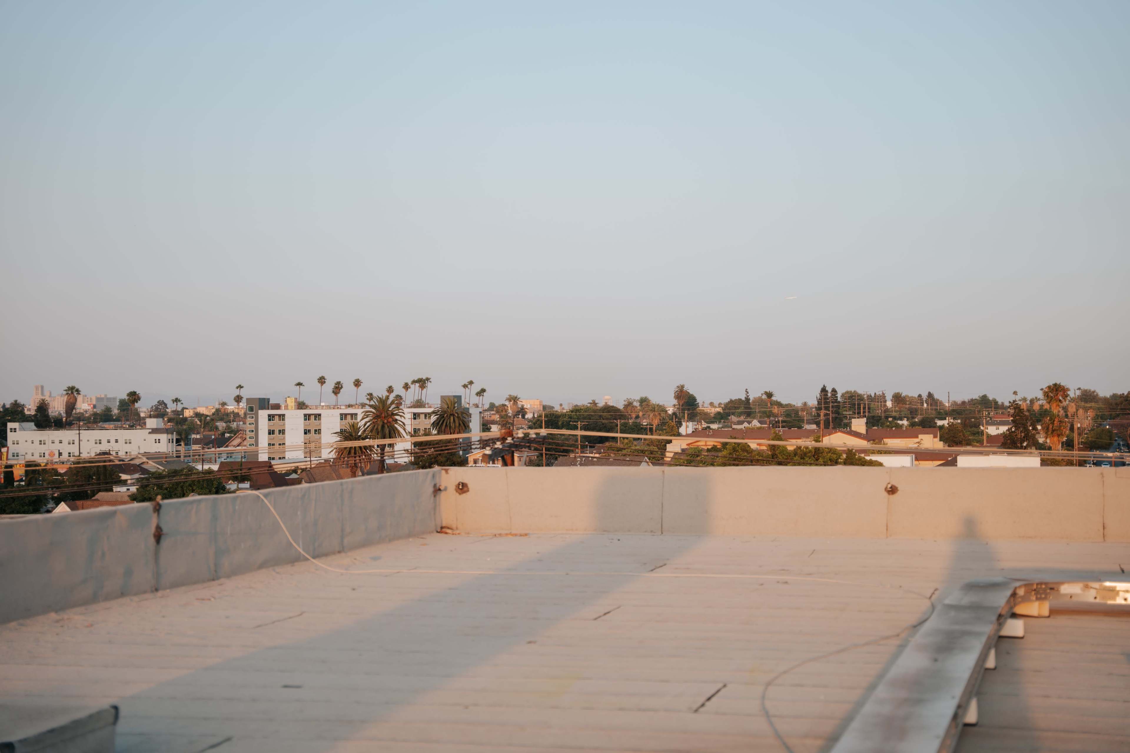 Multi-Set Natural Light Studio w/ Rooftop Skyline Views | FREE lighting/Equipment Included & AC Image in South Los Angeles, Los Angeles, CA
