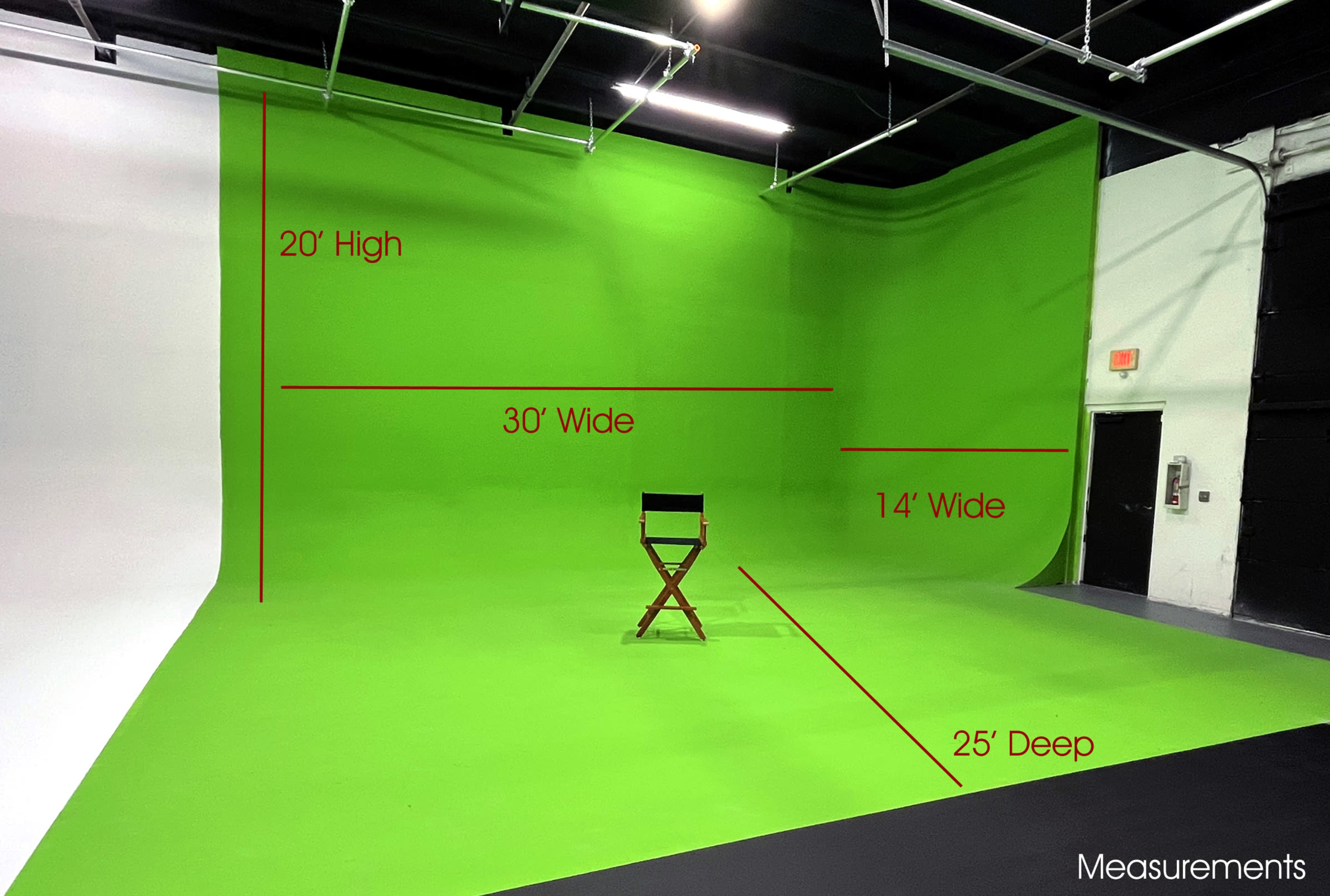 A green screen studio setup with dimensions labeled, featuring a single director's chair placed in the center.