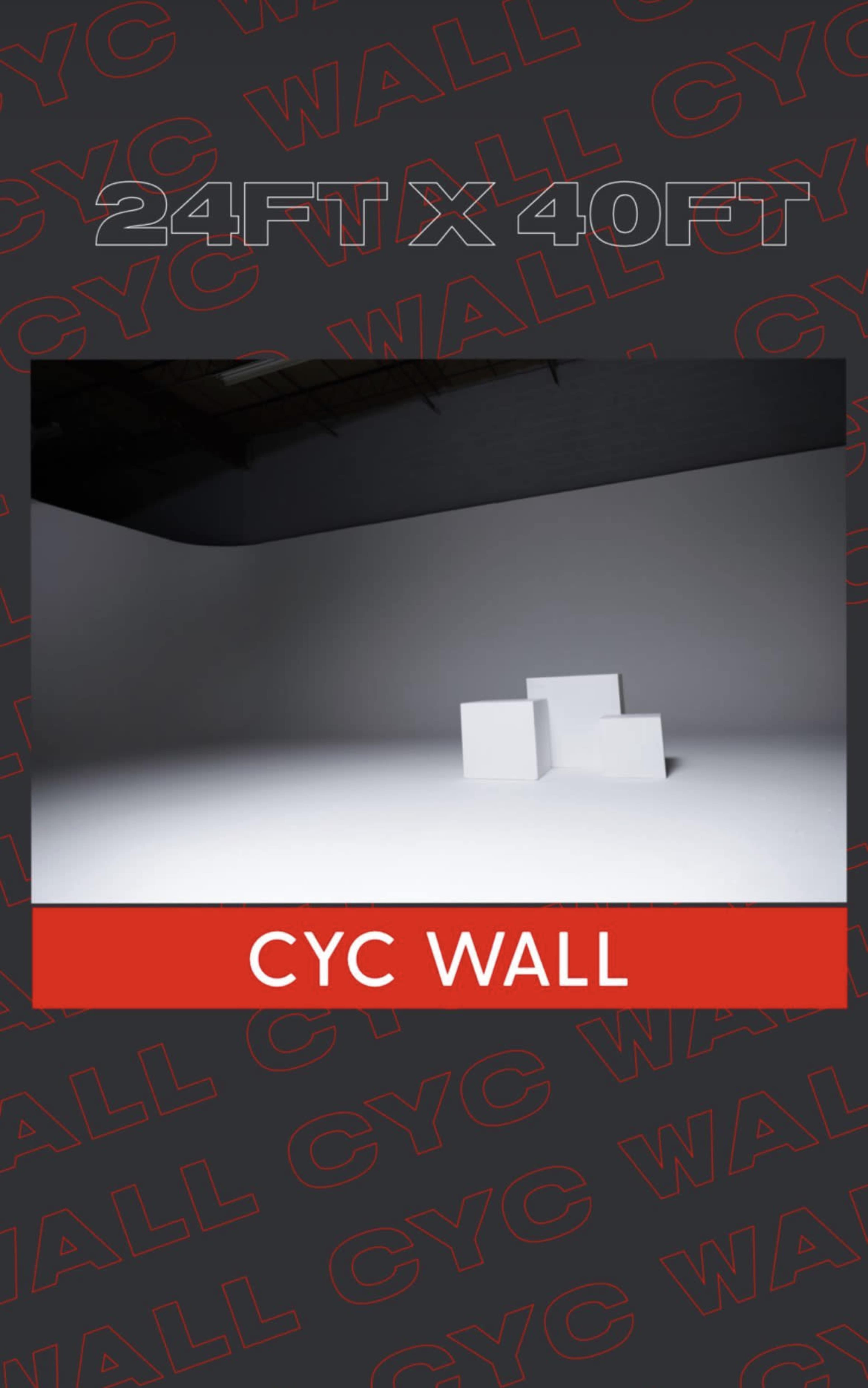The image features a cyc wall setup with three white blocks in a spacious, brightly lit area.