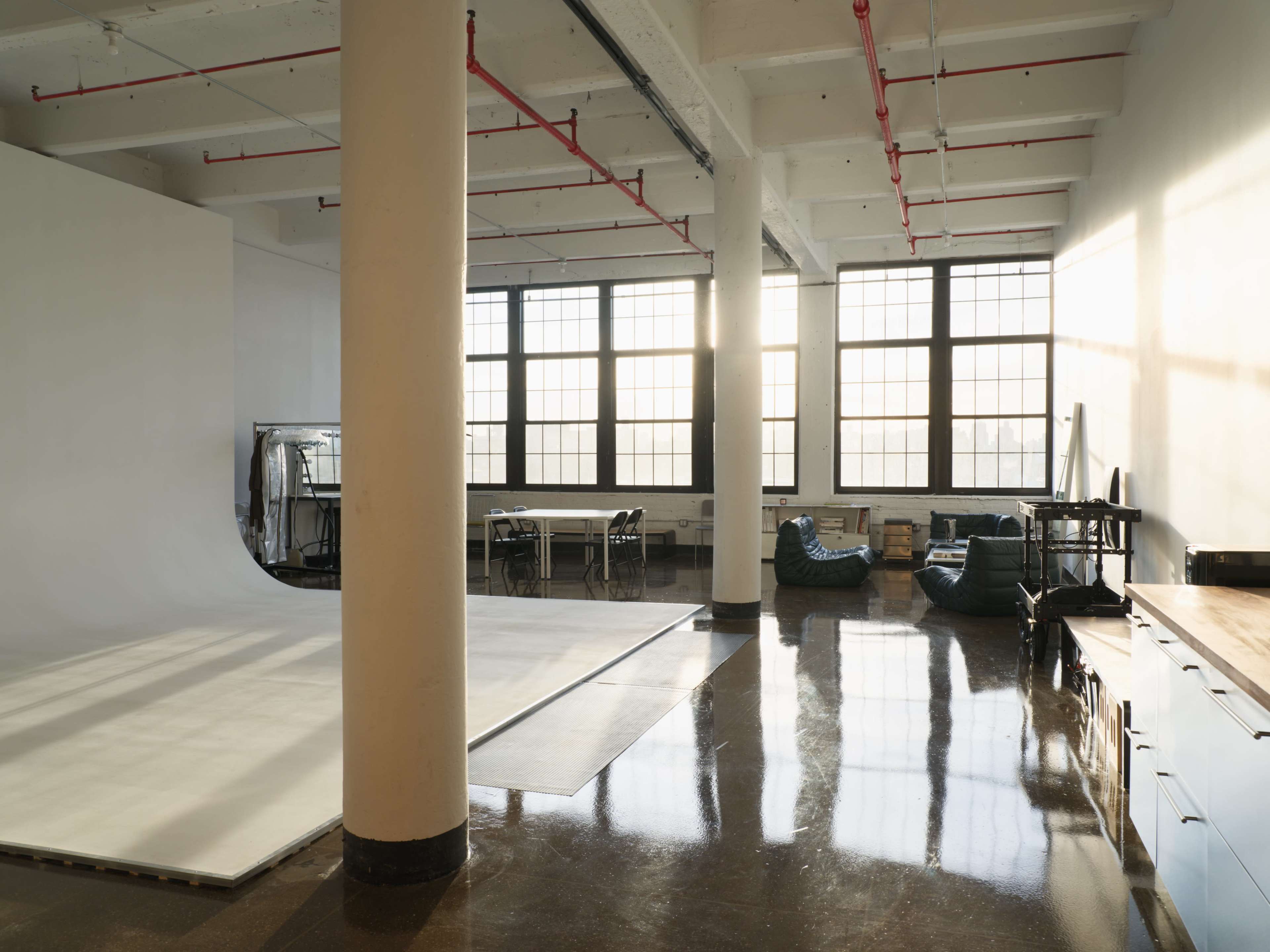 Bright Studio With Cyc Wall And Designer Furniture Image in Bushwick, Brooklyn, NY