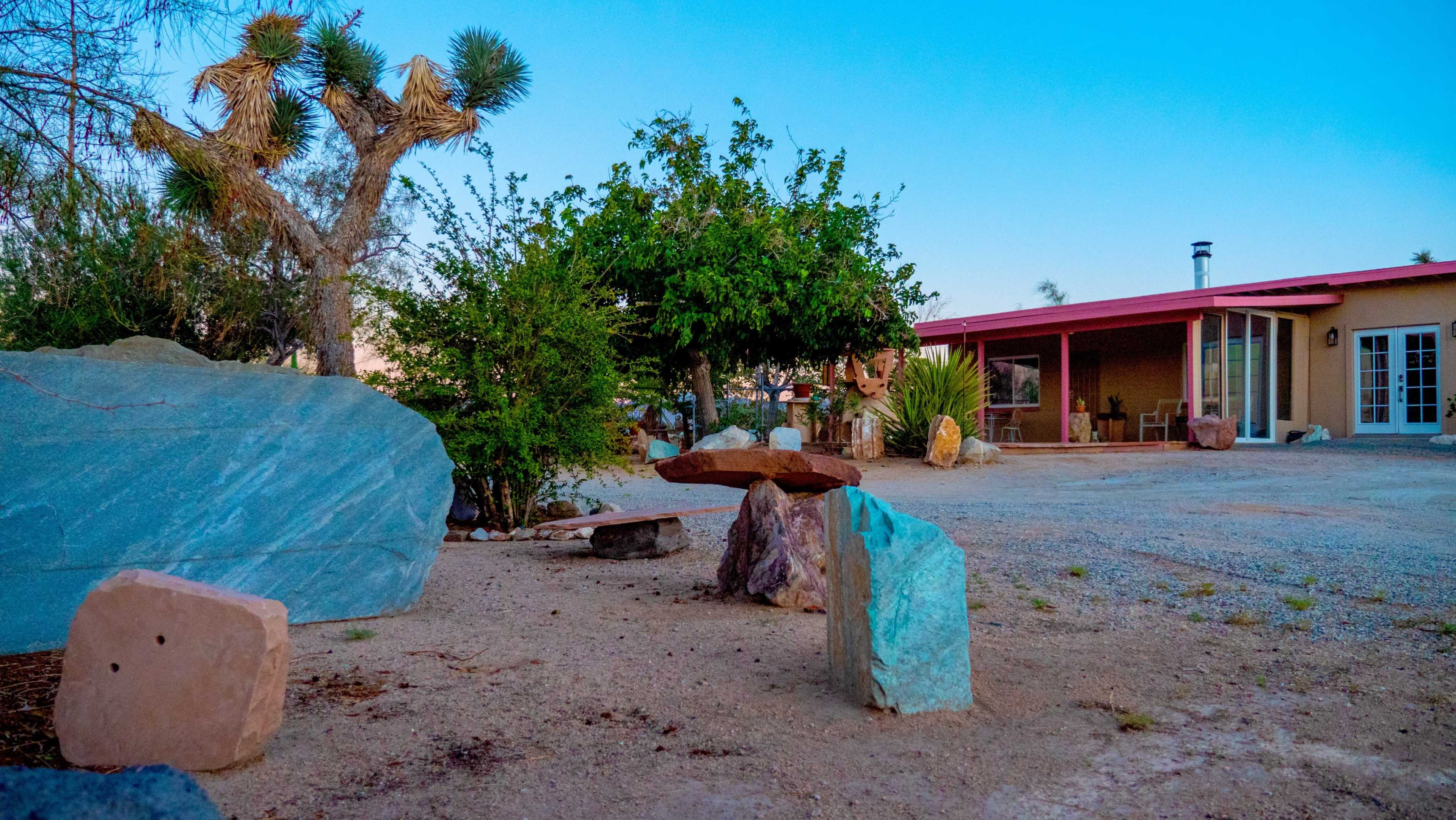 Eclectic Stone Art Home with Secluded Desert View Image in , Joshua Tree, CA