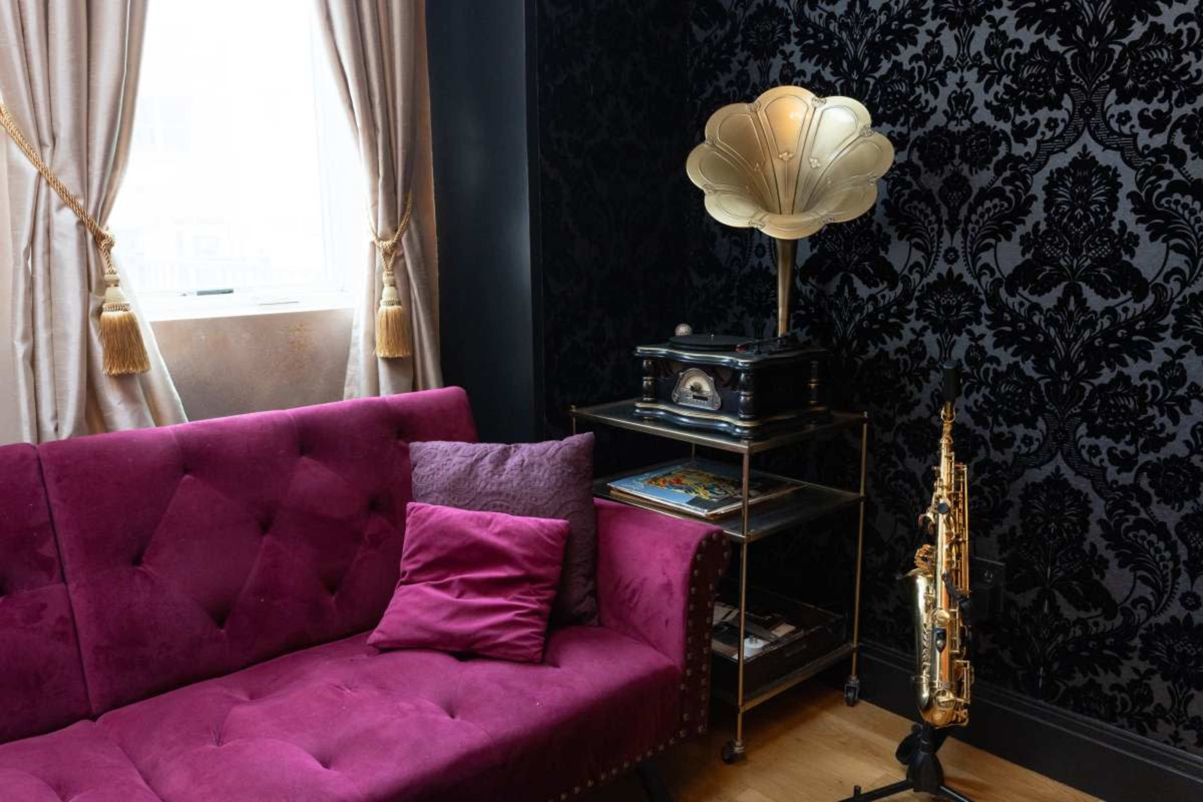 Photo/Video studio with Whitewall, Greenscreen, and vintage speakeasy setting. Image in Bushwick, brooklyn, NY