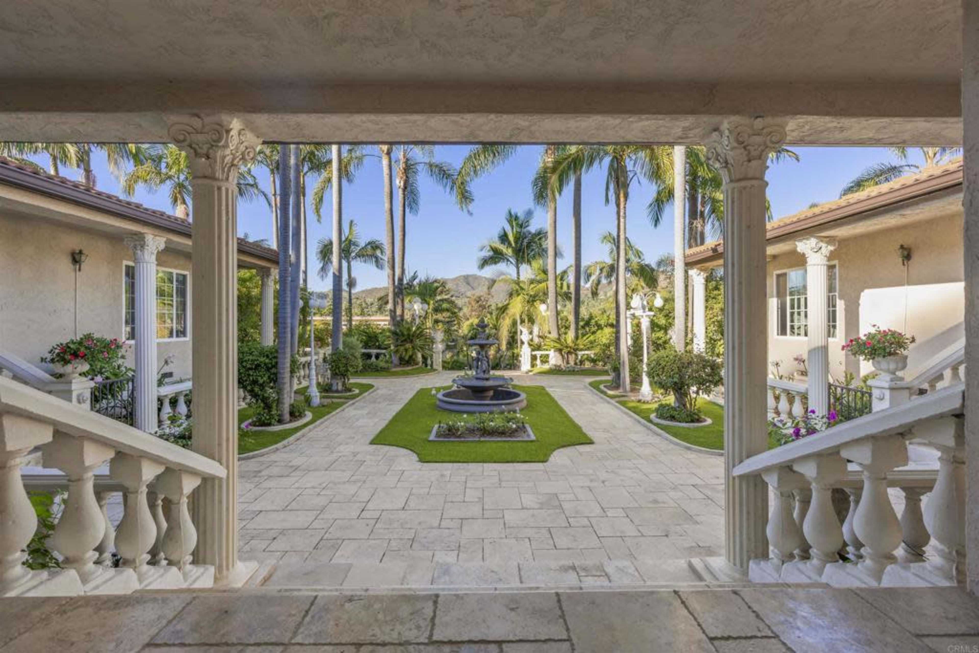 Elegant Outdoor Oasis with Lush Gardens, Pool, and Patios—Perfect for Daytime Events in Vista Image in , Vista, CA