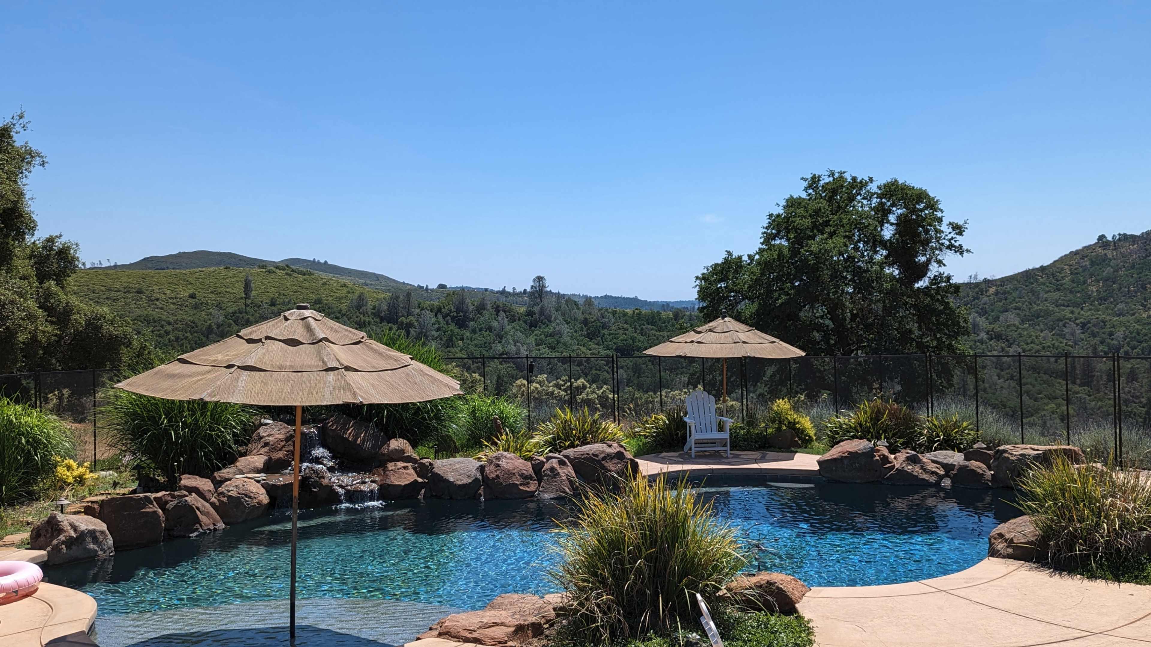 Upscale Pool with Waterfall in Secluded Hilltop Estate with Views Image in , Pilot Hill, CA