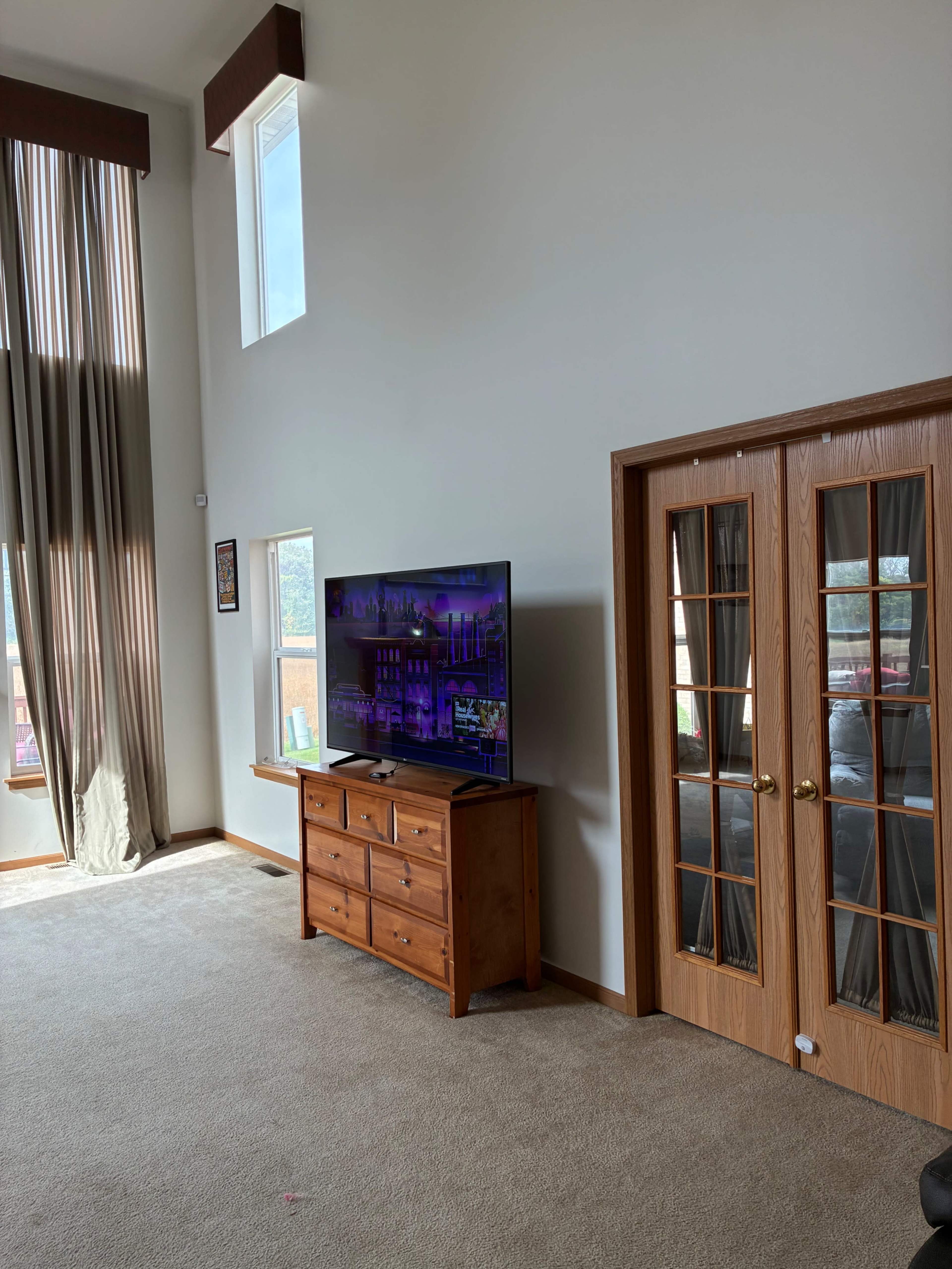 suburban open concept great-room and deck with beautiful forest preserve view Image in Thornton Township, South Holland, IL