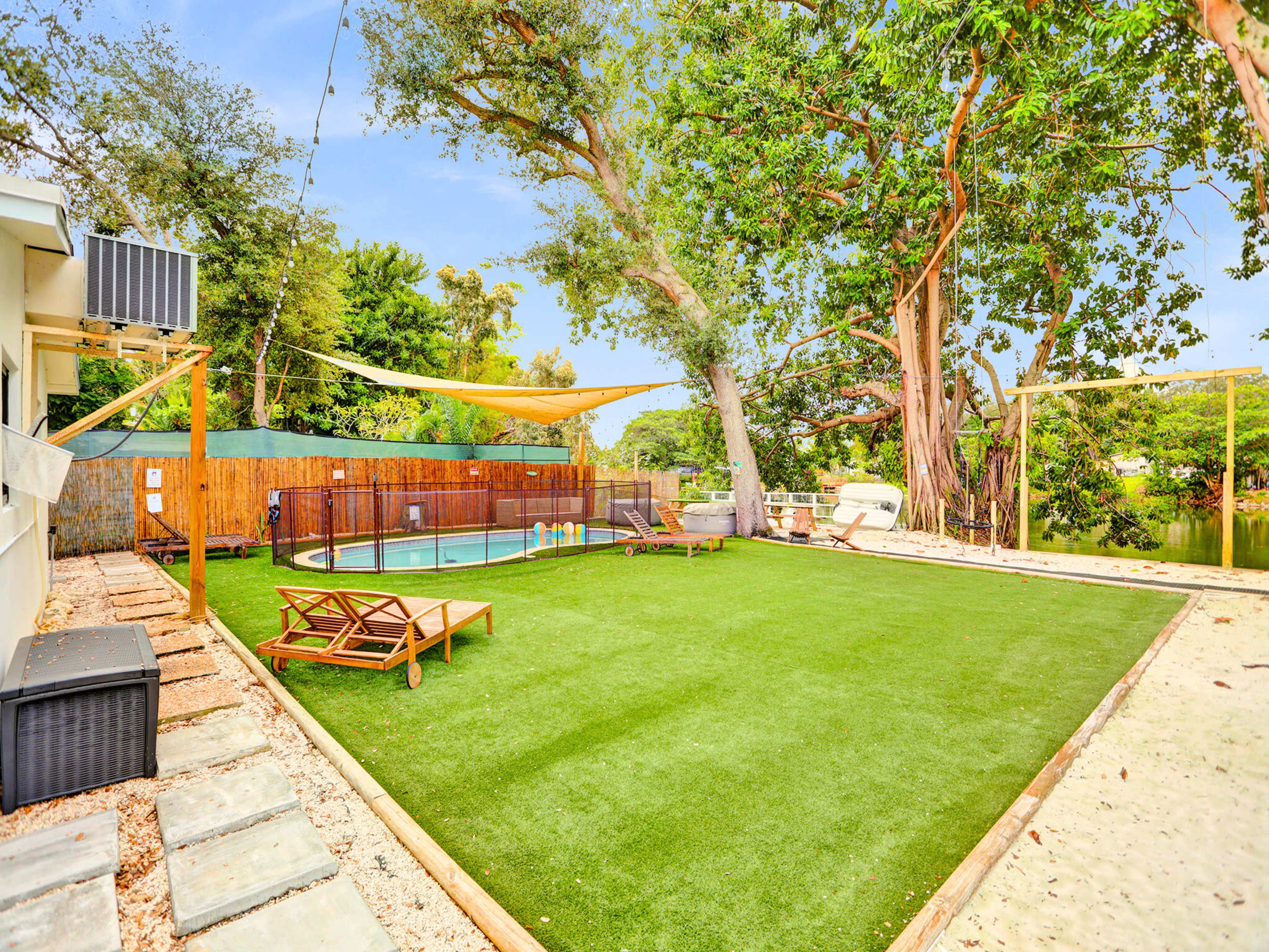 Lakefront Oasis with Pool and Large Backyard Perfect for Events Image in West Park, west paek, FL