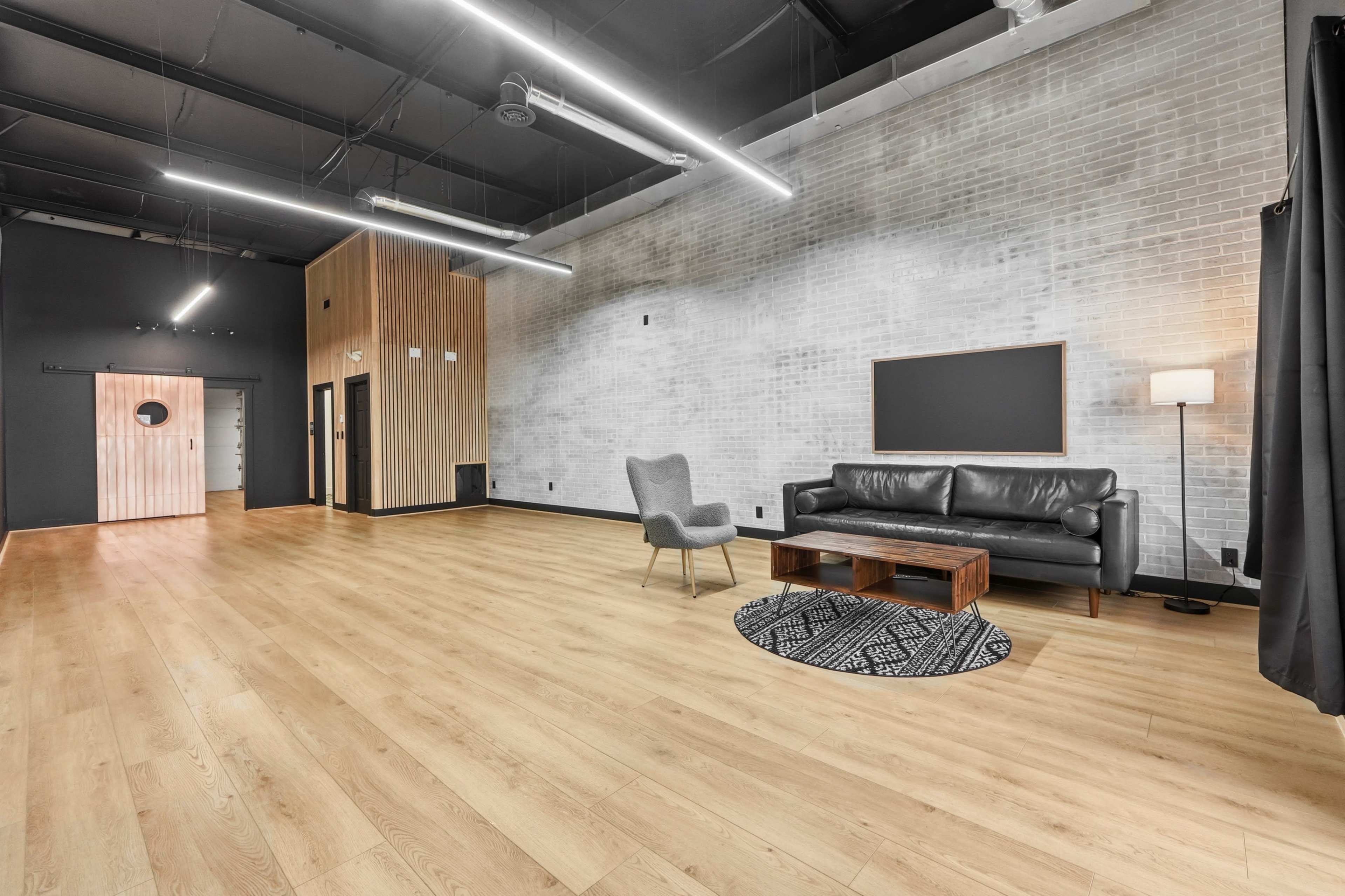 Urban Studio with Modern Wood & Brick Design in Fort Wayne Image in Washington Township, Fort Wayne, IN