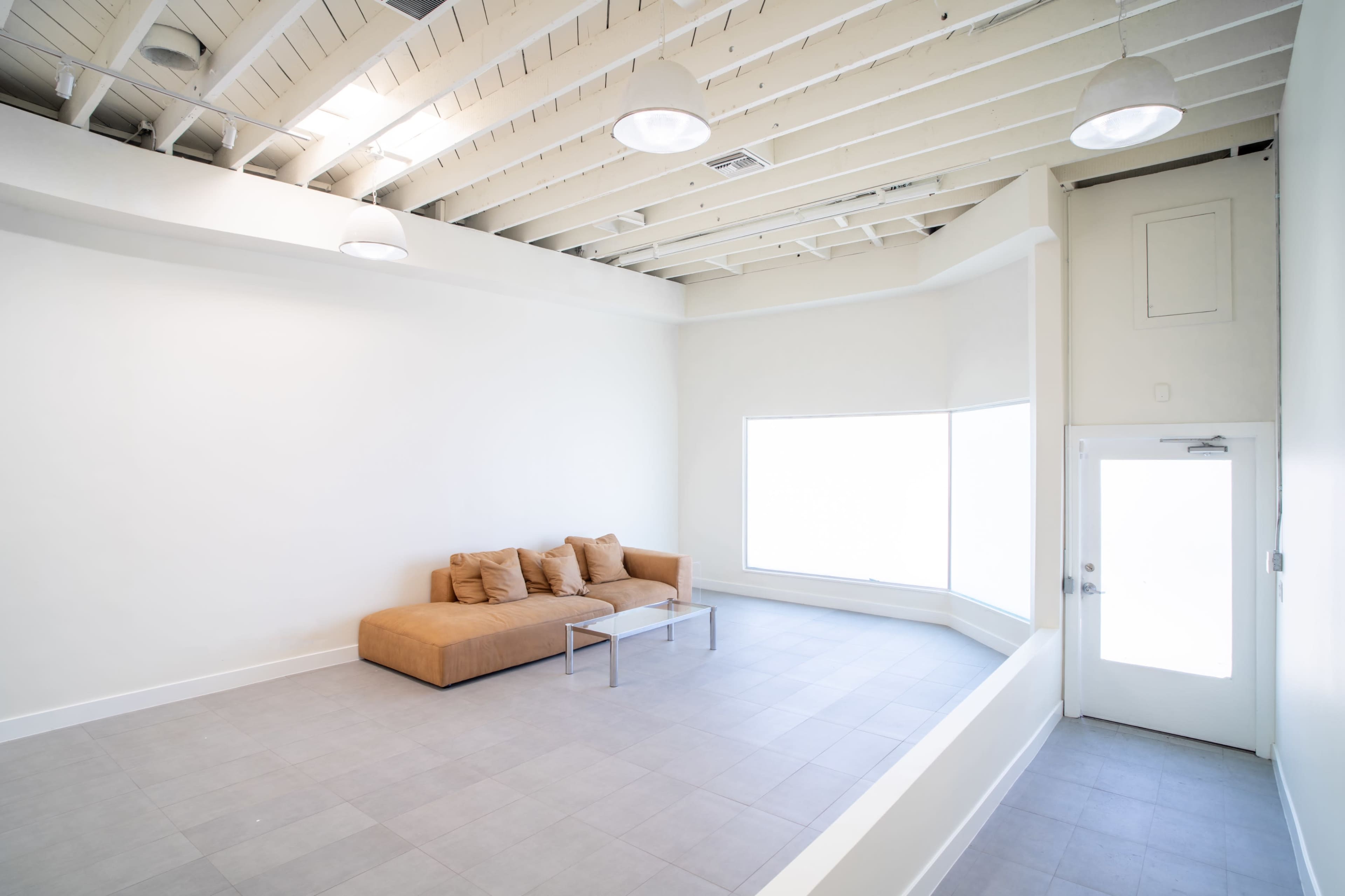 Melrose Fairfax District Minimalist Daylight Photo and Video Studio Space with Modern Minimalist Furnishings and Backdrops Image in Beverly Grove, Los Angeles, CA