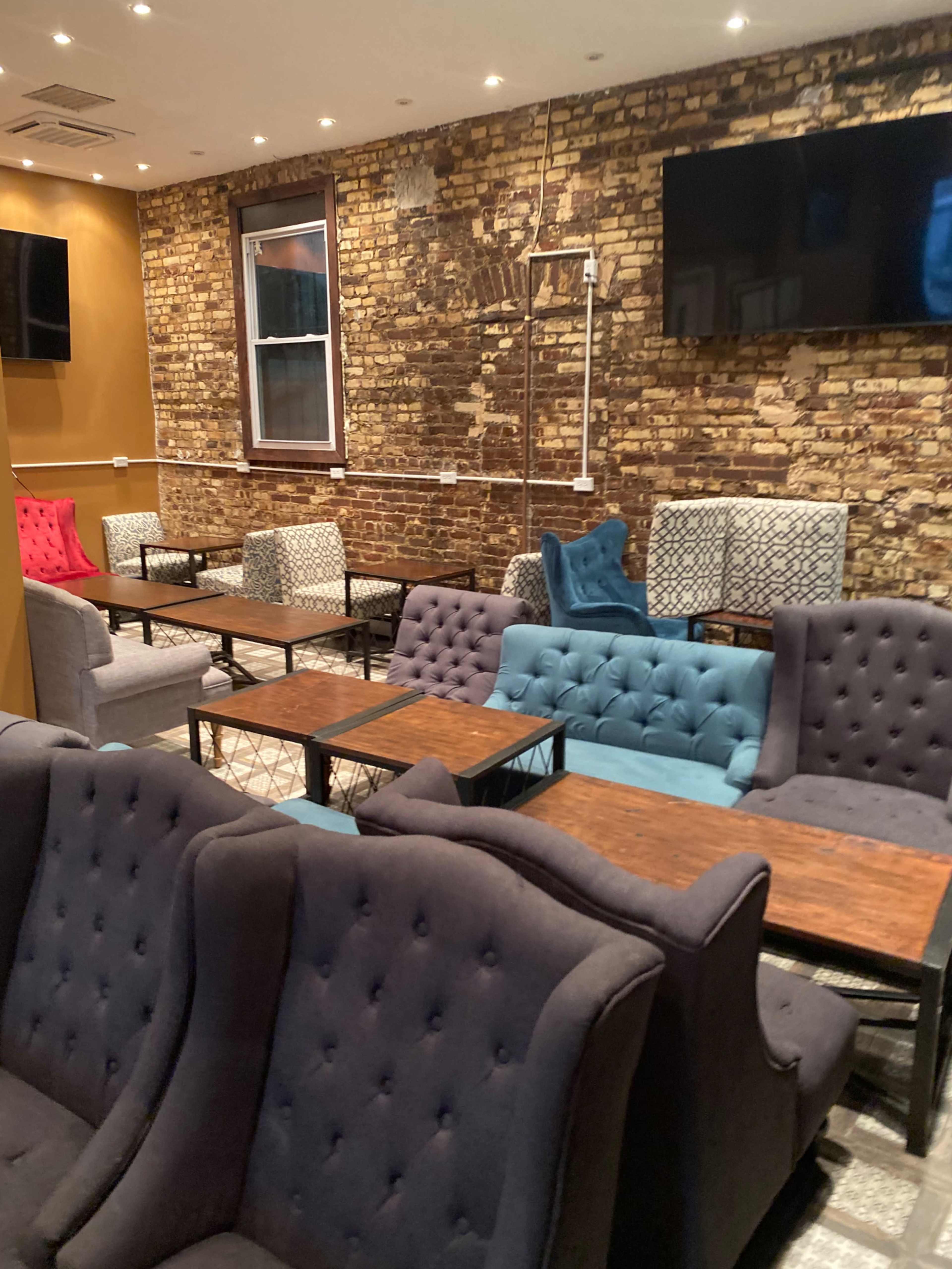 Cafe Lounge with lots of TVs and couches Image in West Bronx, Bronx, NY