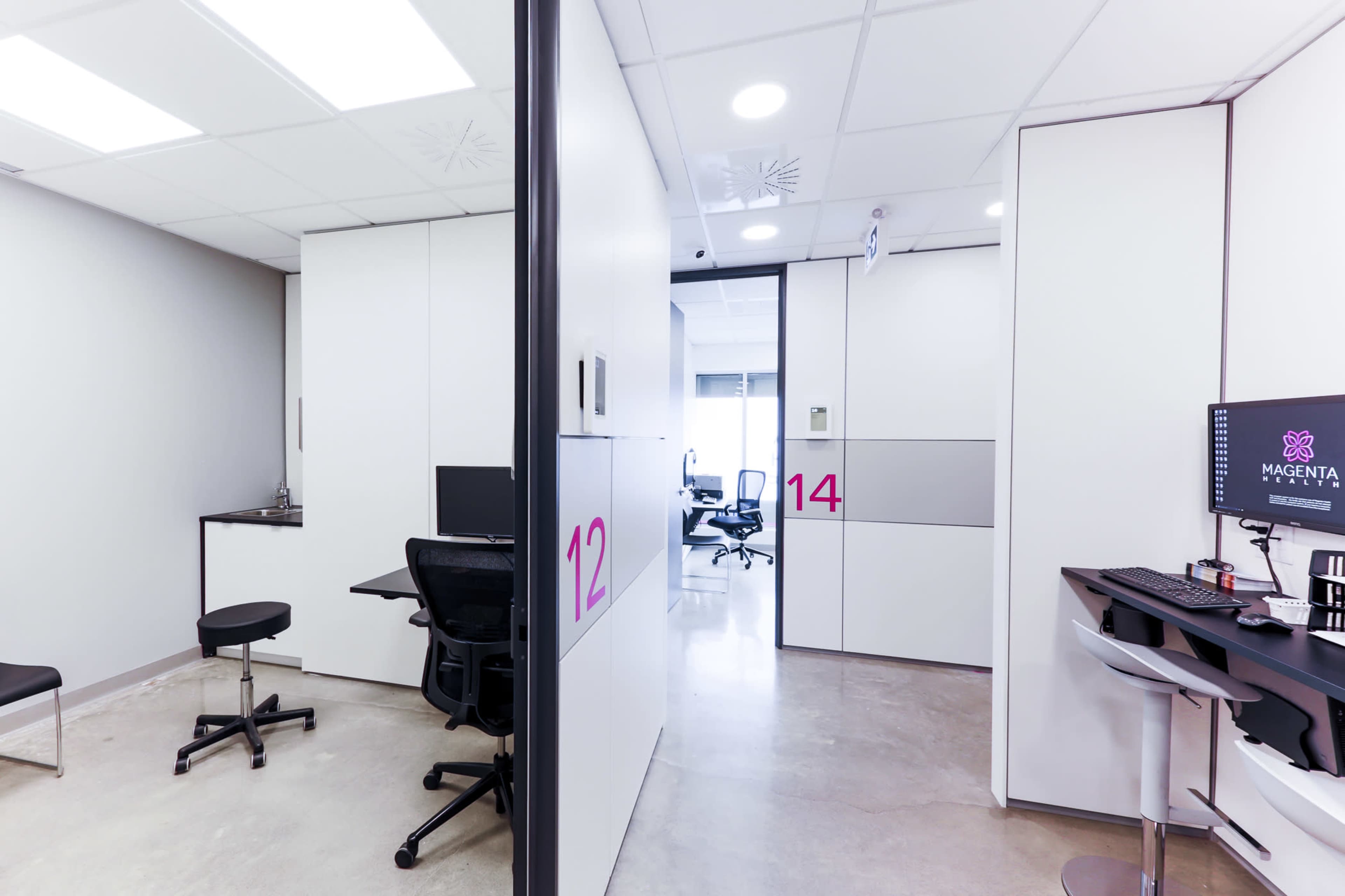 The image shows a modern office space with two rooms numbered 12 and 14, featuring sleek furniture and computer workstations.