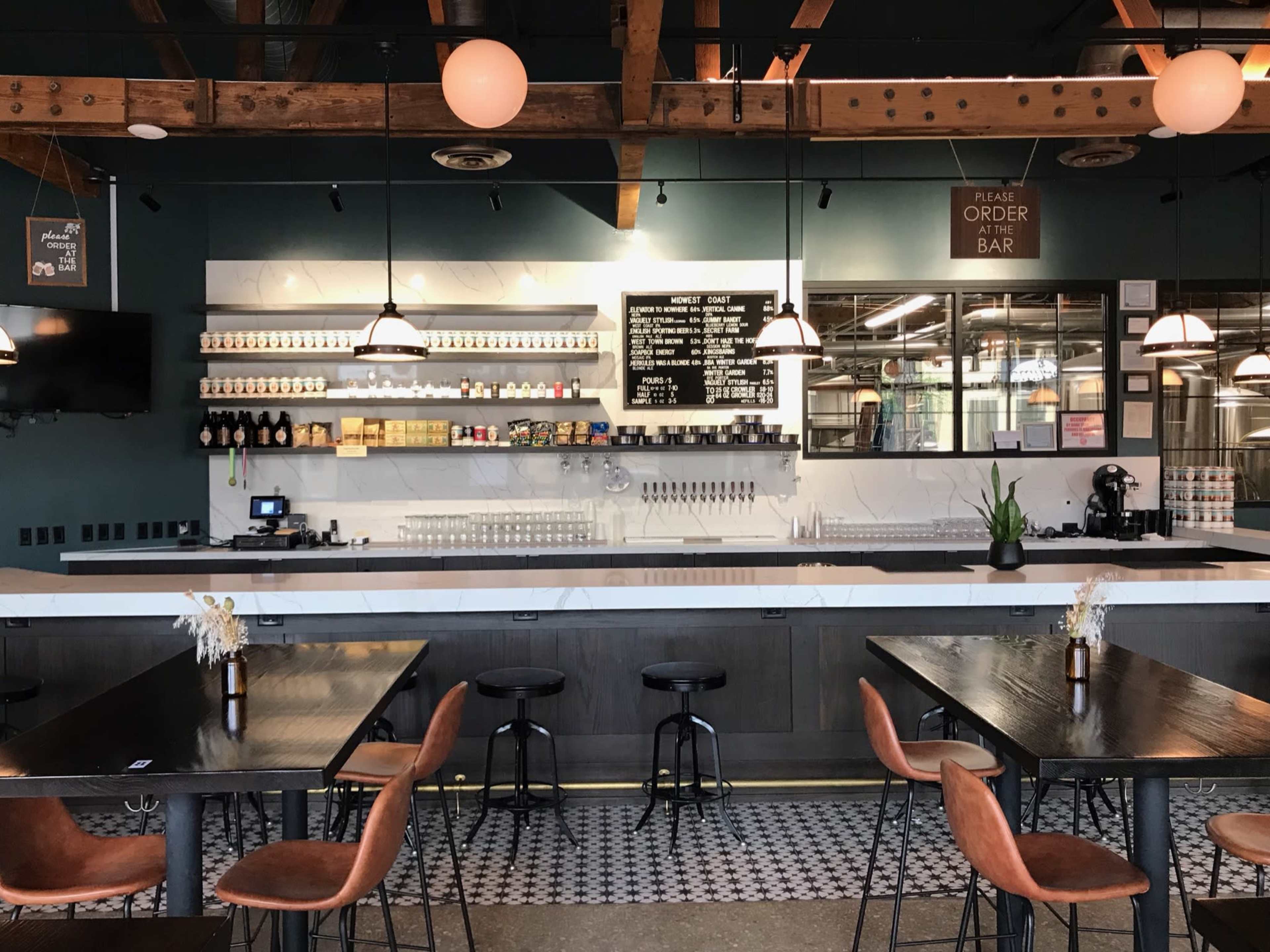 Industrial, exposed brick, wooden bow truss ceiling, brewery, taproom Image in Near West Side, Chicago, IL