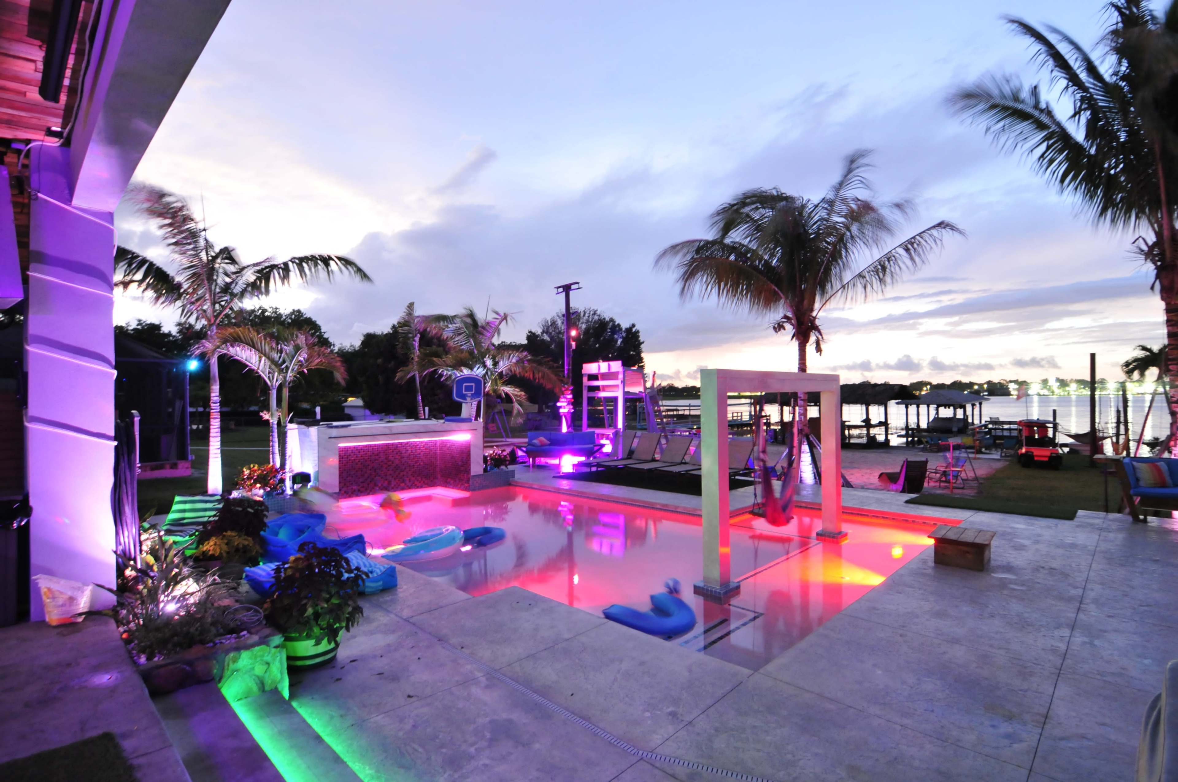 Lakefront grotto Palm Oasis, Sand Volleyball, and Custom Pool Features Image in , Orlando, FL