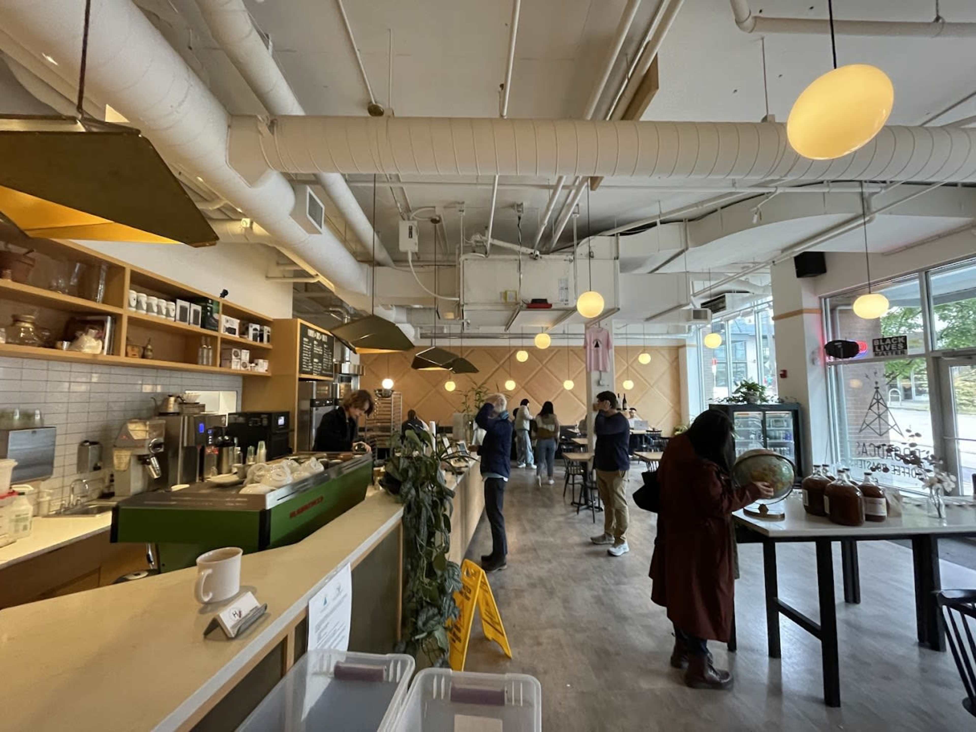 This cafe displays a great mix of a industrial and modern feel to it, making it a perfect place to relax and hangout, whilst also being a great place be productive and get things done. The cafe is located in a diverse area with homes and schools nearby, but it also consists of a city enviornment, along with the light rail being a 2 minute walk away. Lastly, best of all the coffee/staff/community is amazing. Image in Roosevelt, Seattle, WA
