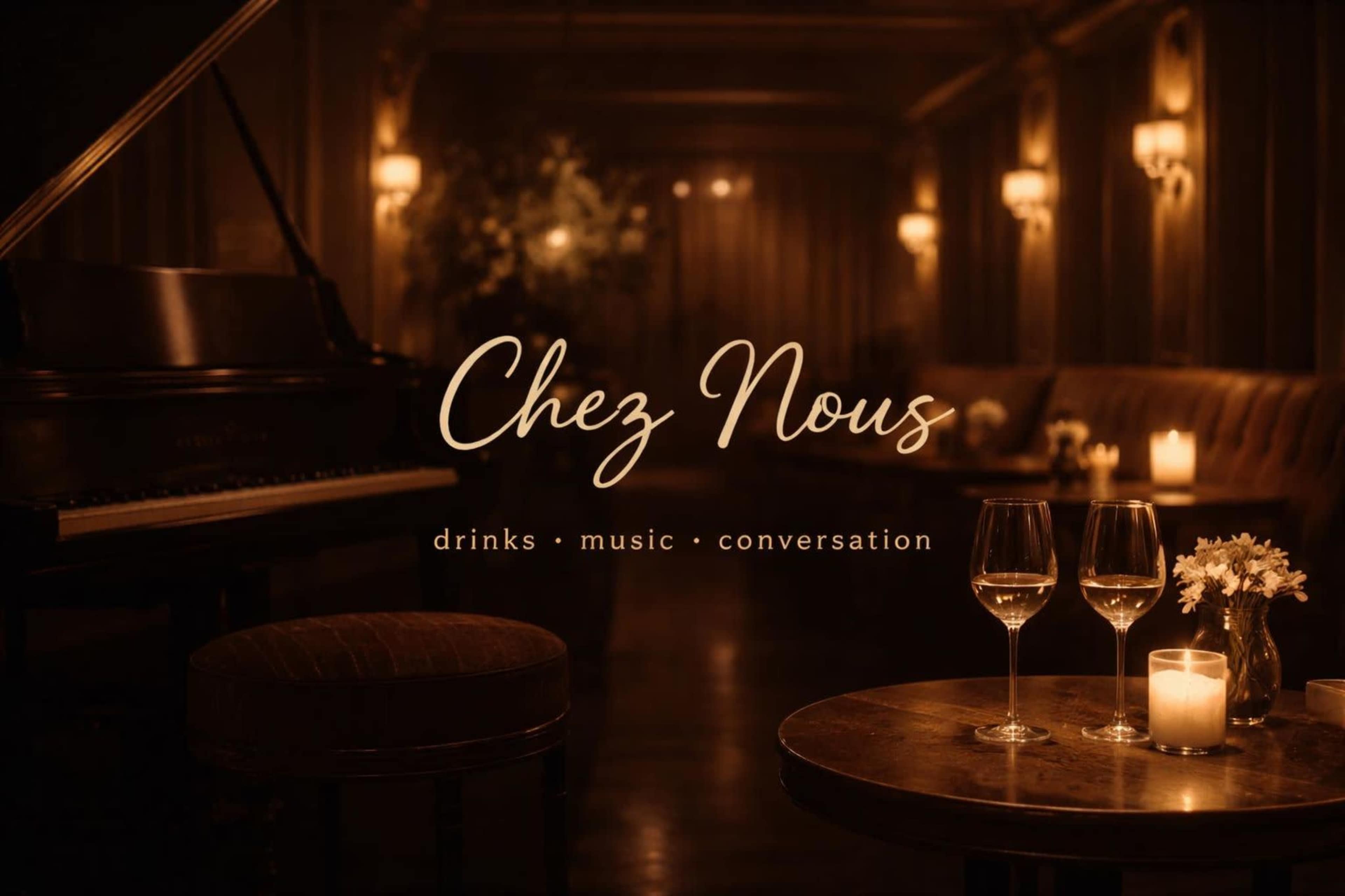 The image depicts a dimly lit lounge with a piano in the corner, two wine glasses on a table, and soft lighting creating an intimate atmosphere.