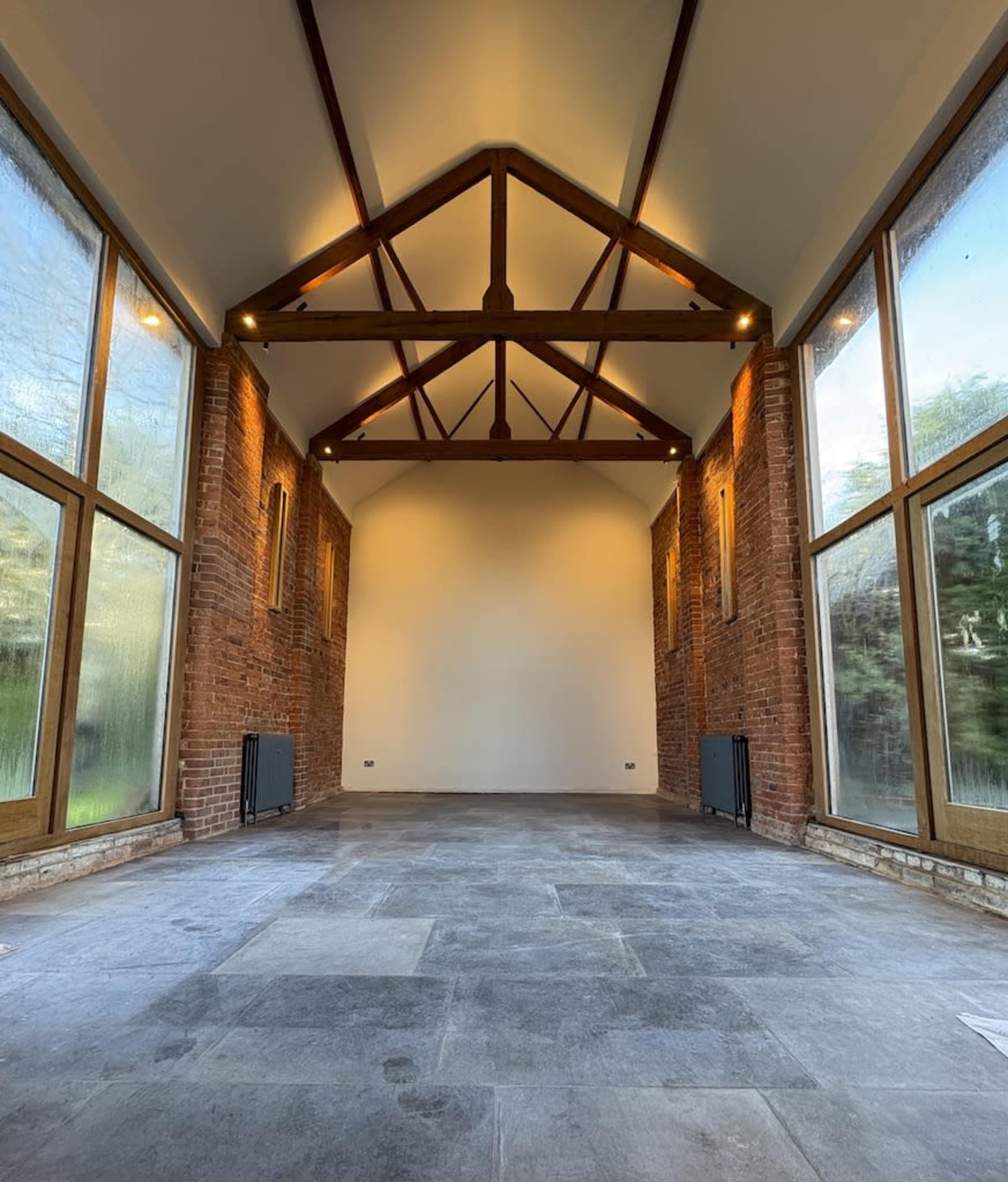 Unique barn space with floor-to-ceiling windows, exposed brick walls and a fully equipped kitchen Image in Edington, Westbury, ENG