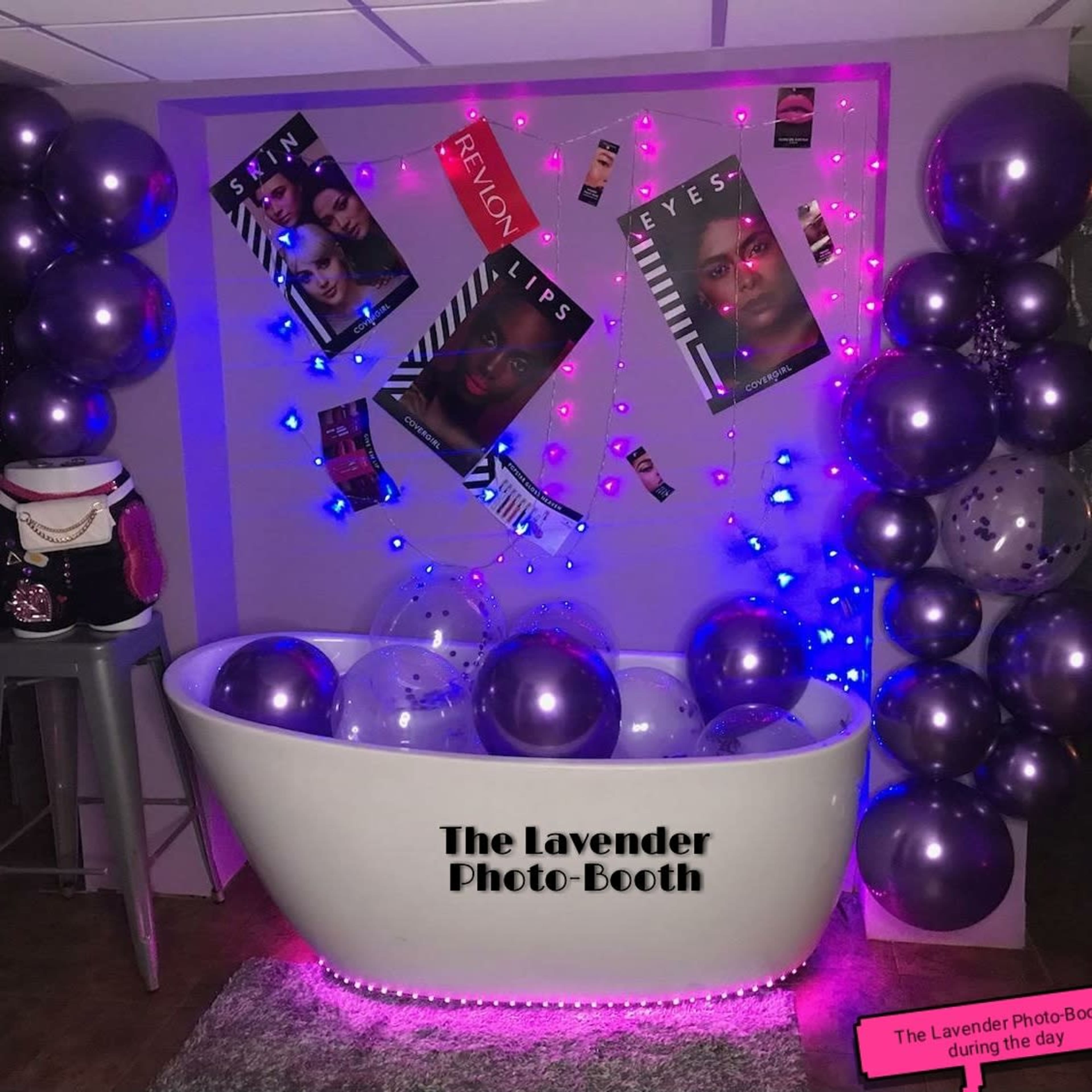 The image features a photo booth setup with a white bathtub filled with clear balloons, surrounded by purple and pink balloons, and decorated with posters showcasing beauty products.