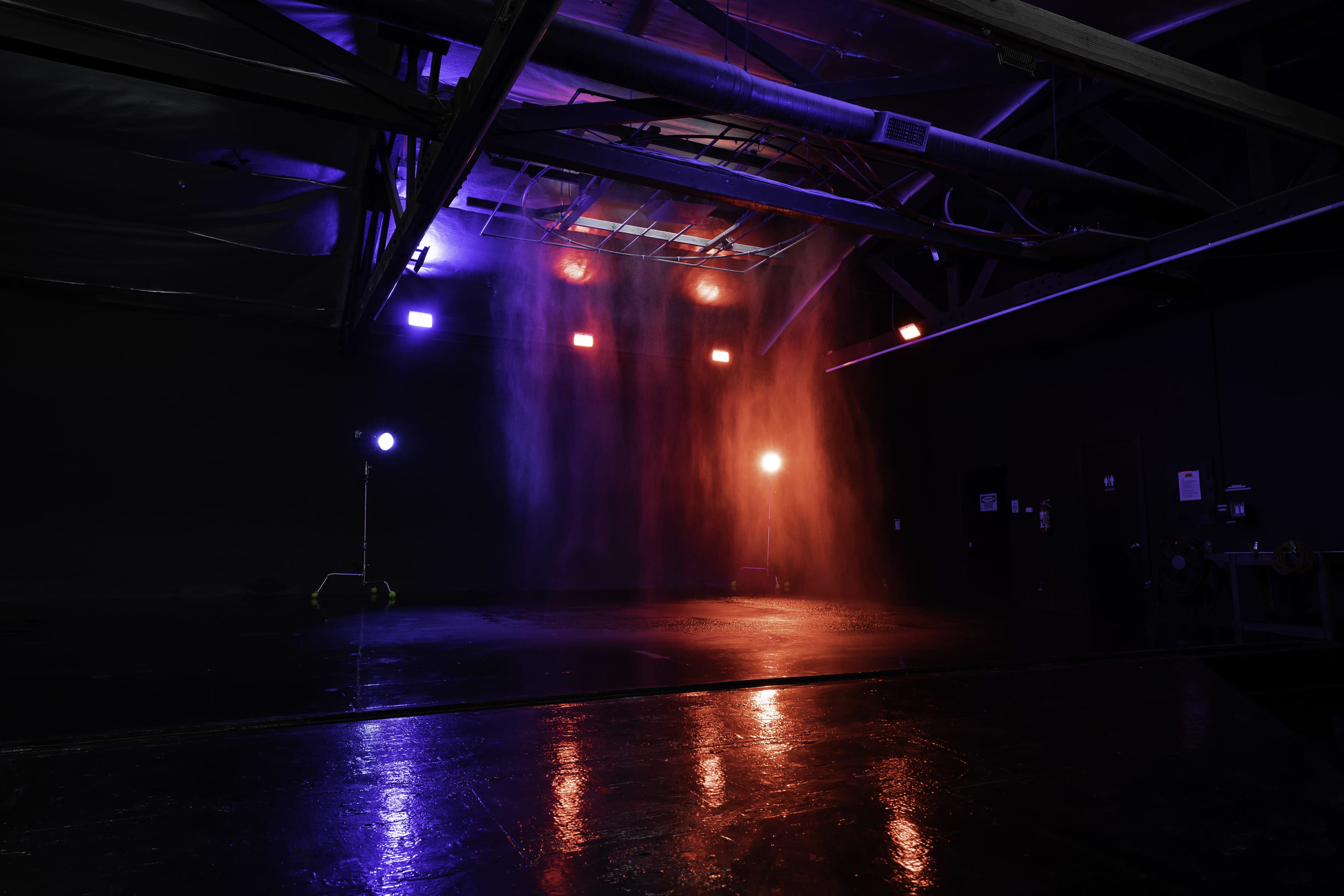 Blackout Car Photo & Video studio with large black cyc wall,  RGB LED Tunnel, rain feature, free parking and roll-up doors - Olympic 2 Image in Boyle Heights, Los Angeles, CA