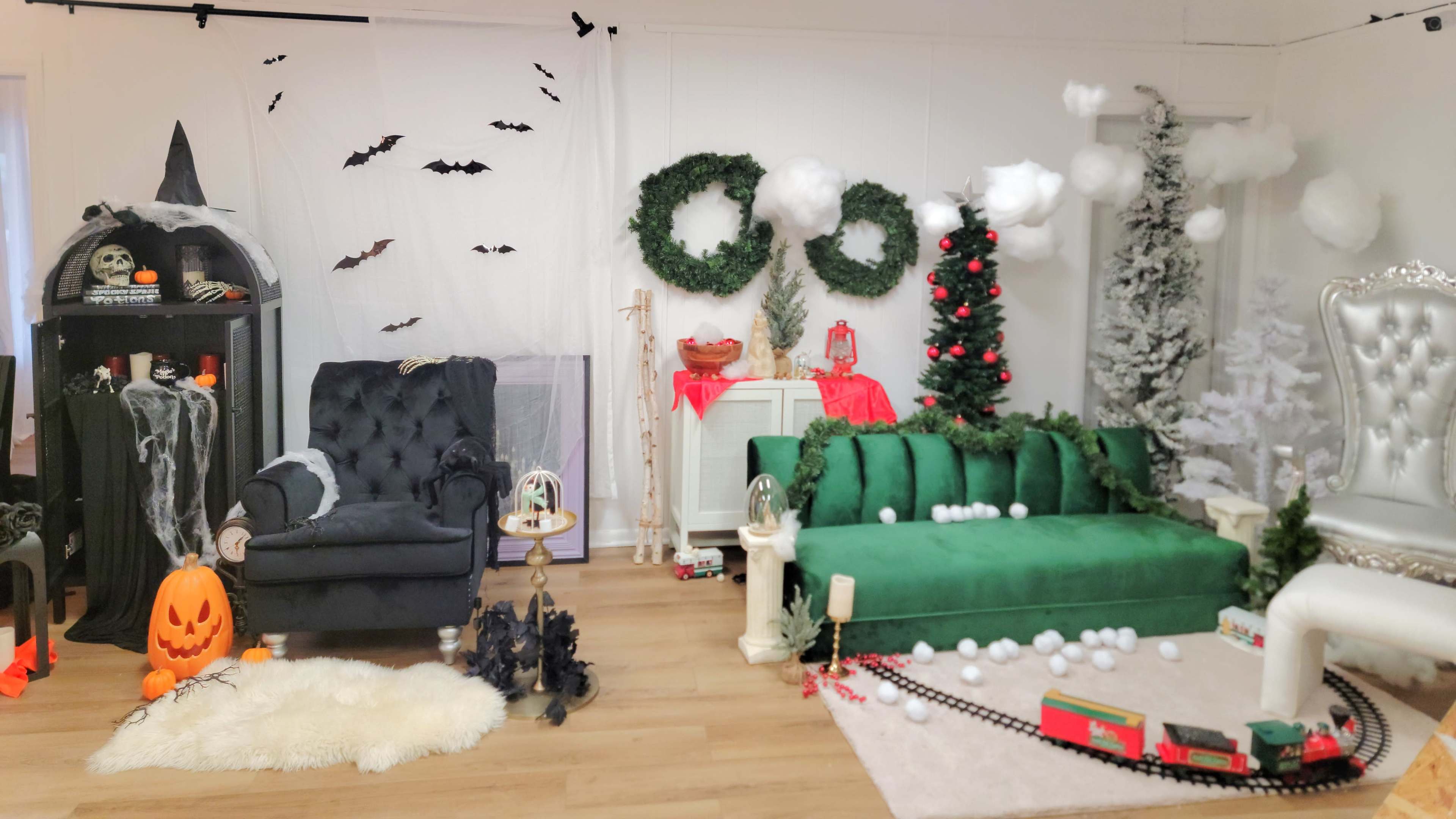 The scene features a decorated room with a black chair, a green sofa adorned with garlands, a Christmas tree, and various Halloween decorations.