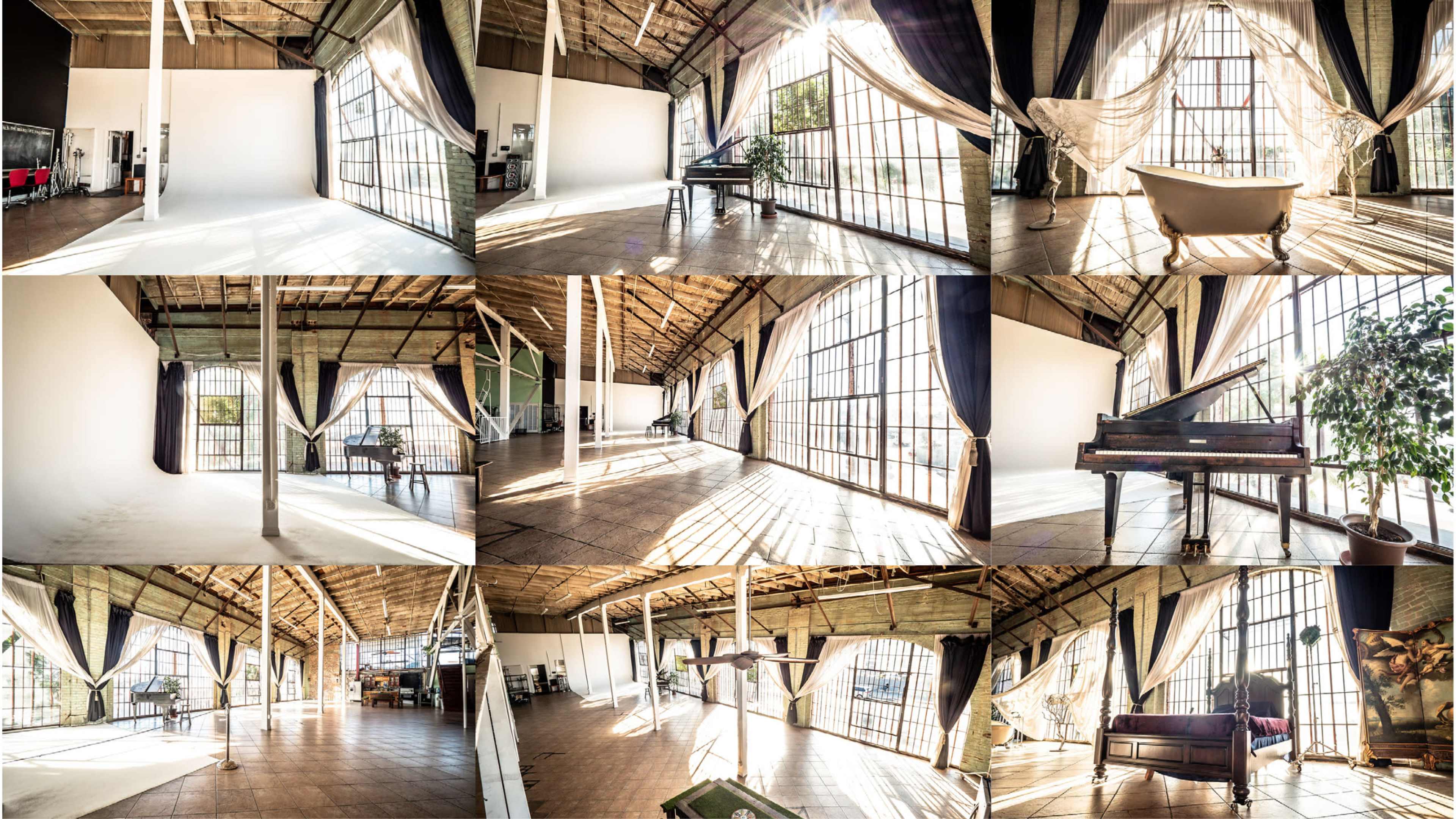 A spacious, well-lit studio with large windows, featuring various areas including a bathtub, a piano, and seating arrangements.