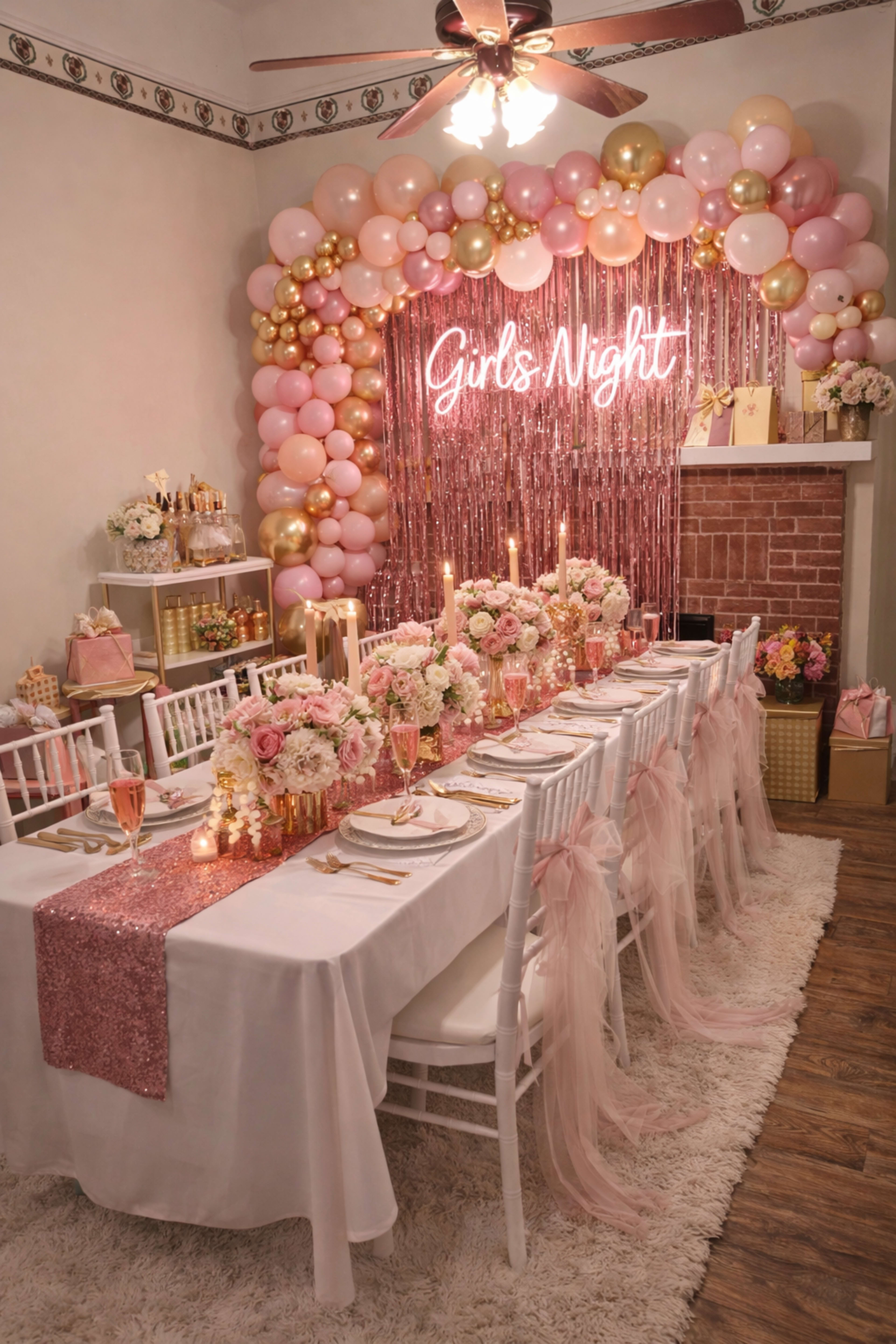 The image shows a beautifully decorated dining area for a girls' night celebration, featuring a long table adorned with floral arrangements, pink and gold accents, and a backdrop of balloons and a neon sign.