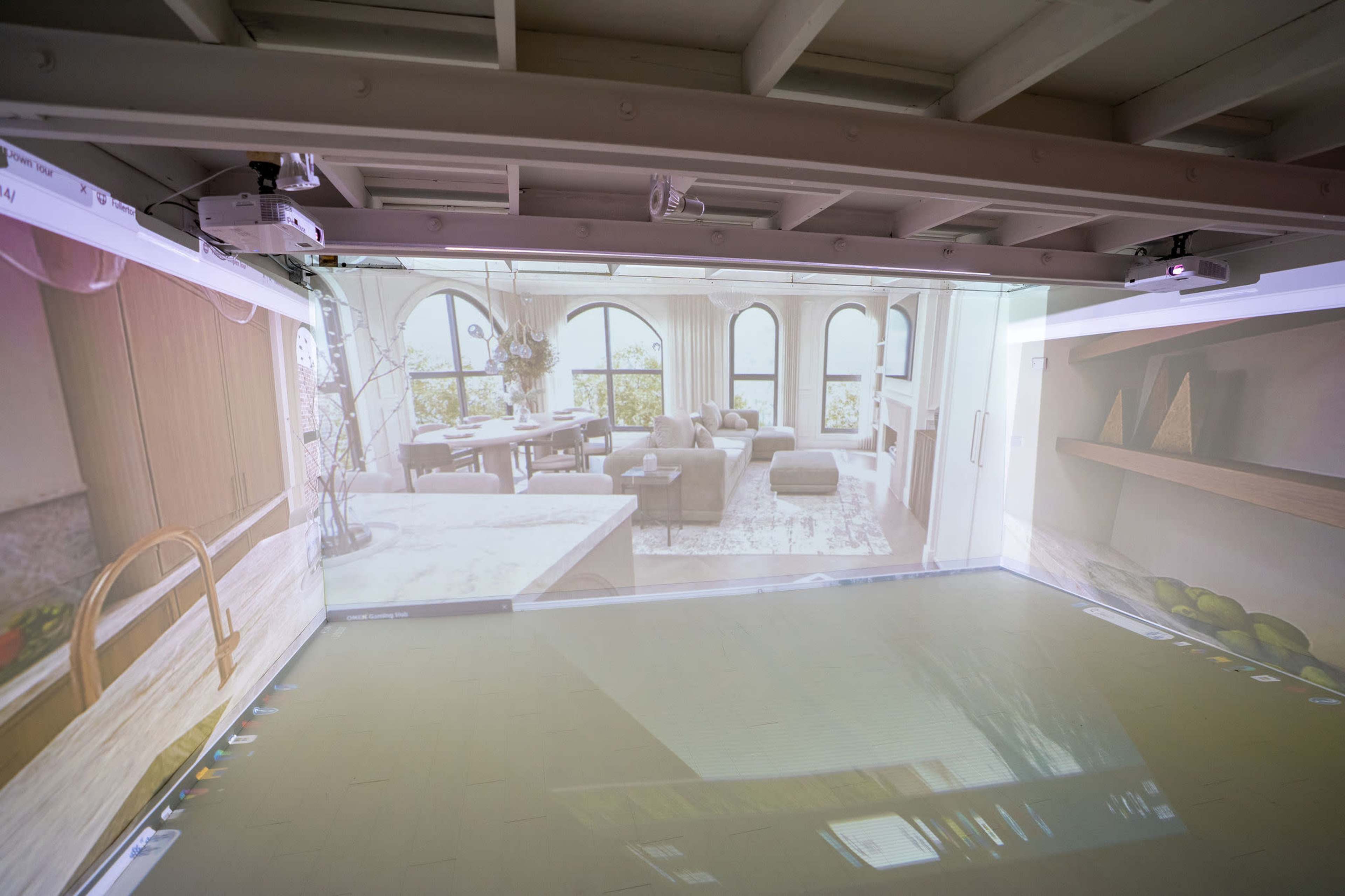 A room features projected images of modern interior design on its walls, creating an immersive visualization environment.